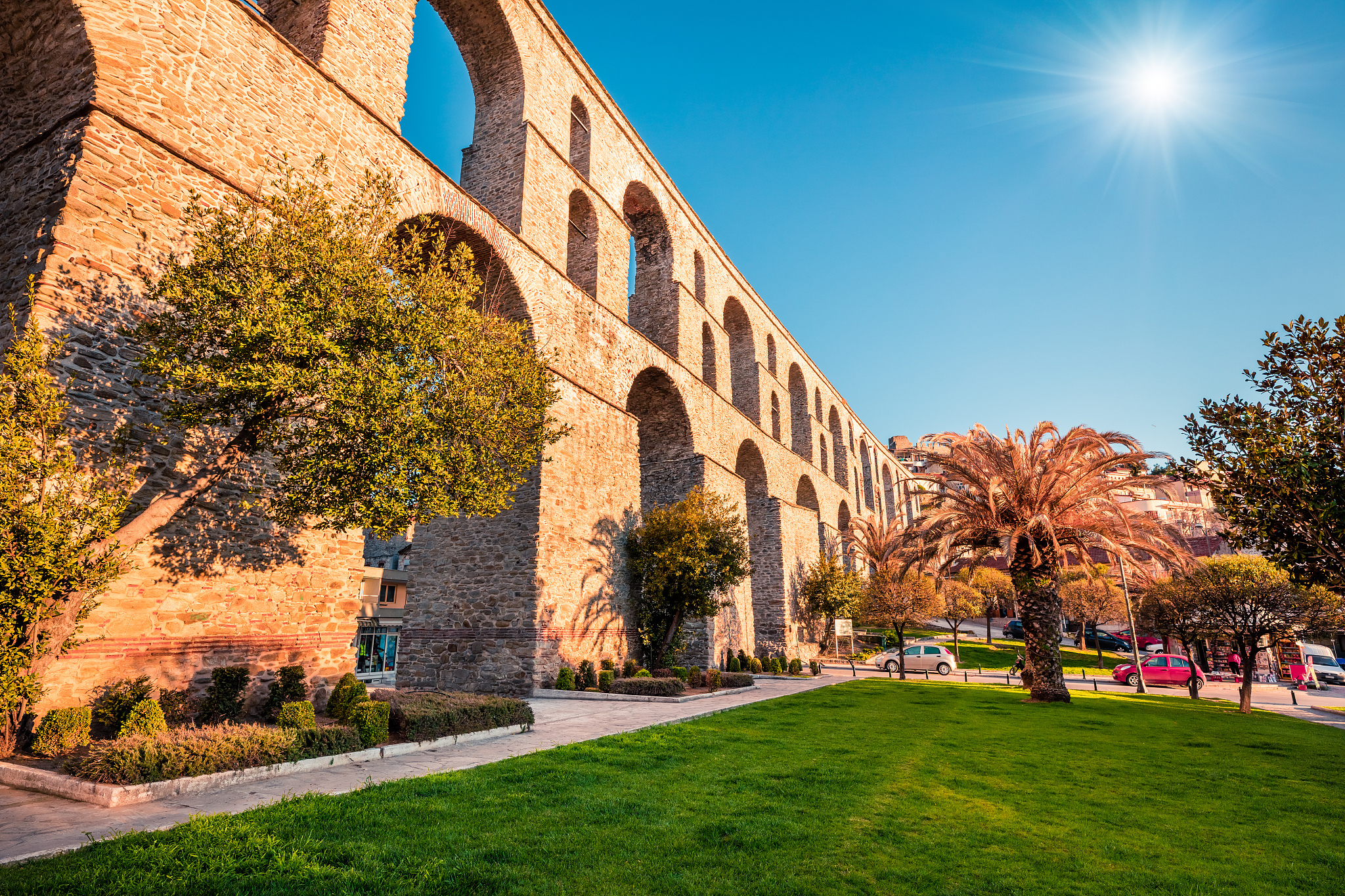 cityscape with medieval aqueduct kamares in the kavala city. sun