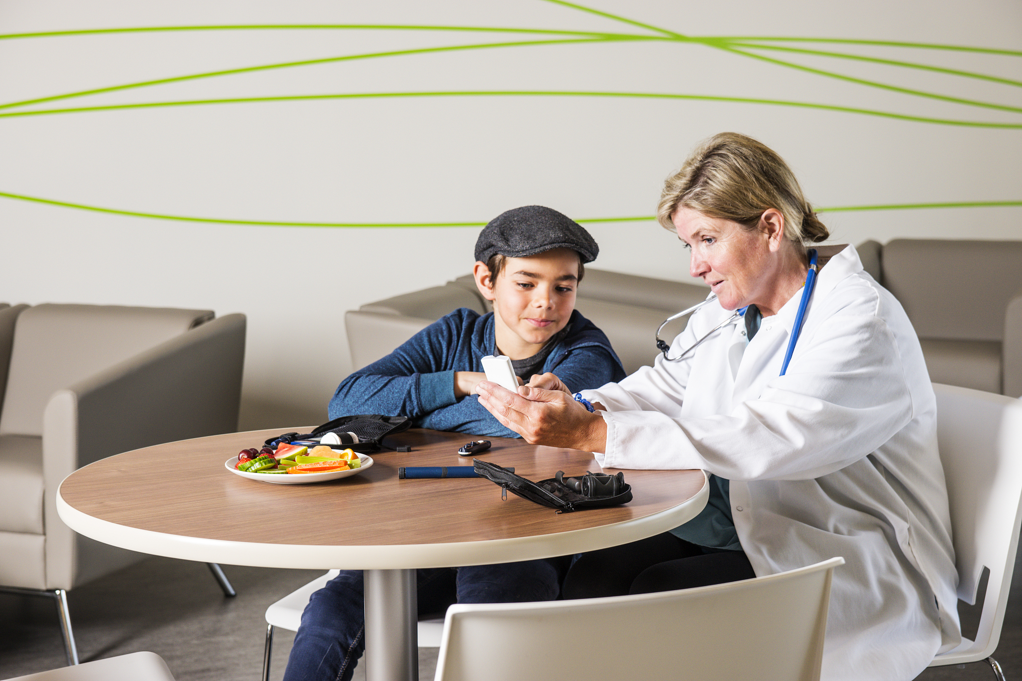 diabetes healthcare specialist with a young patient