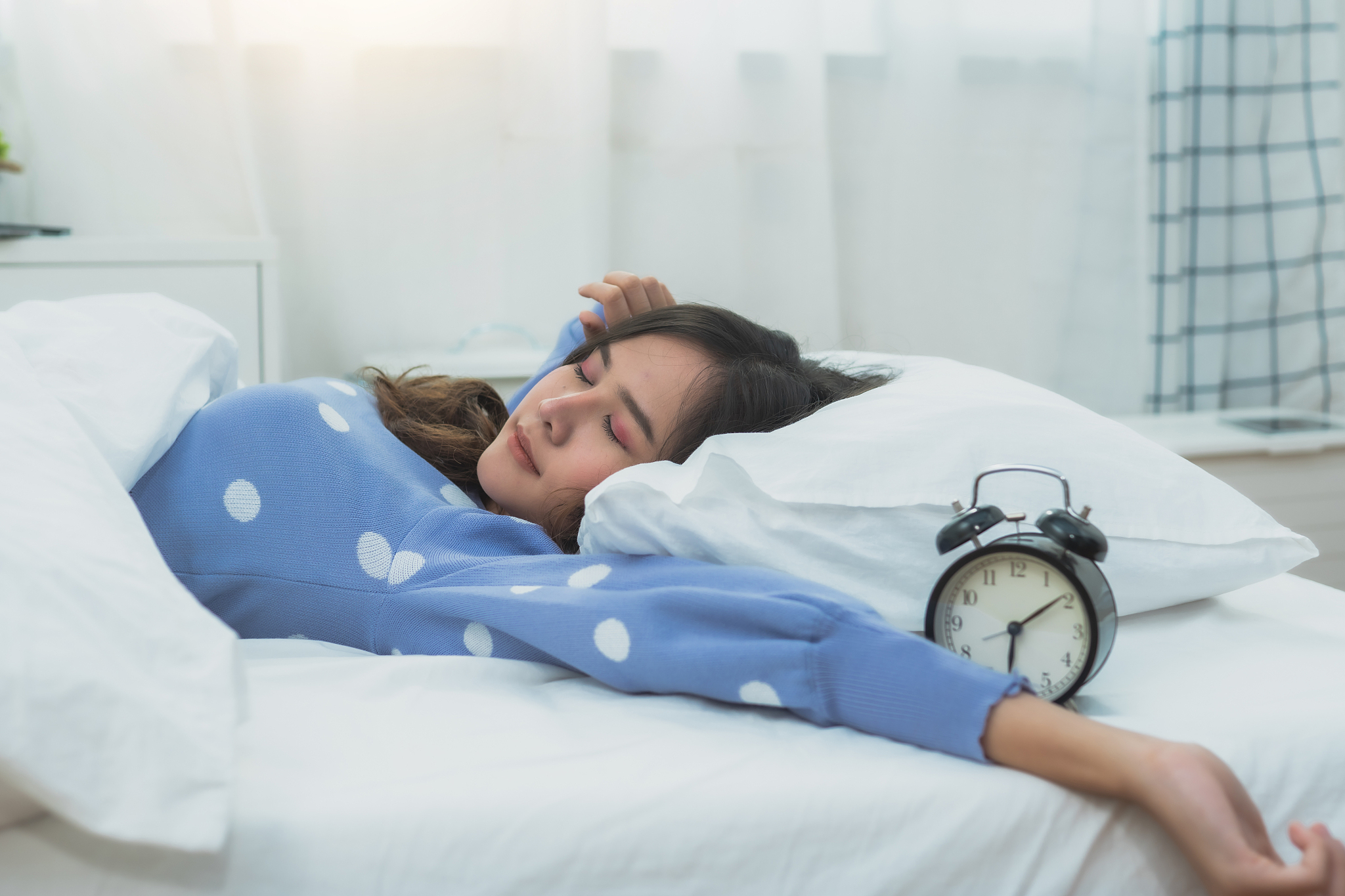 beautiful woman sleep on bed and get up late