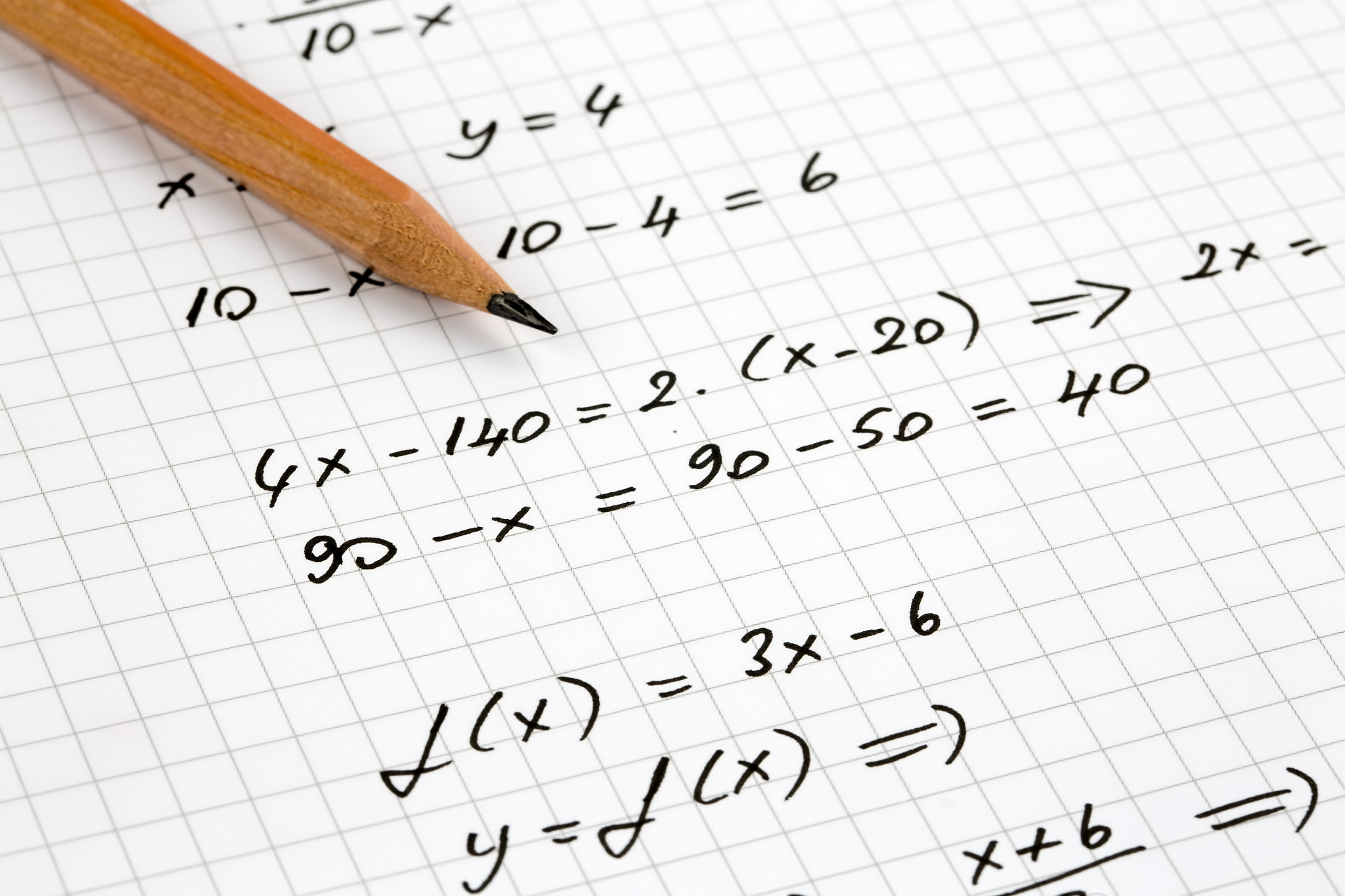 close-up of hand written mathematical formulas. concept of educa