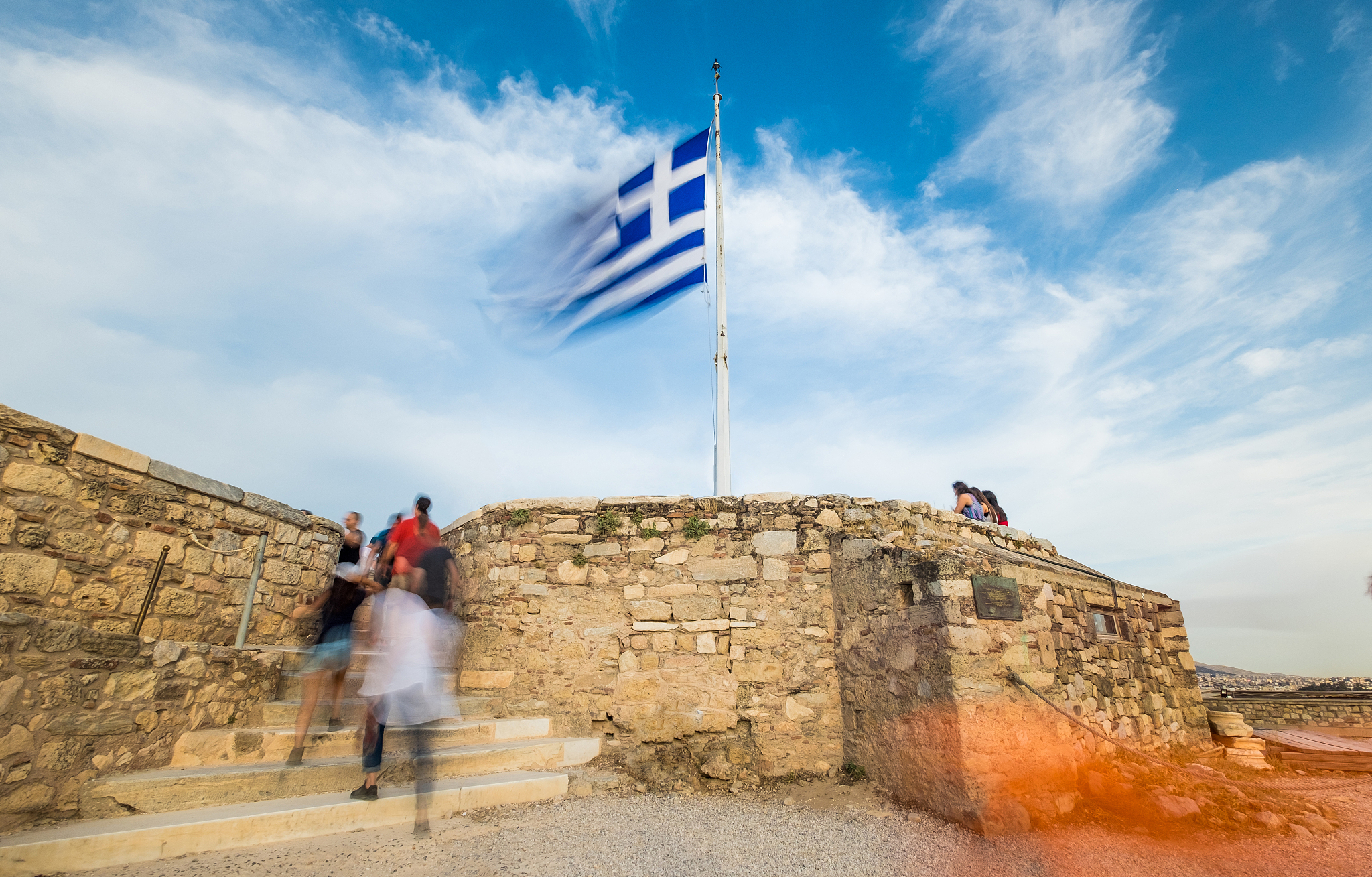 greek flag waving against blue sky