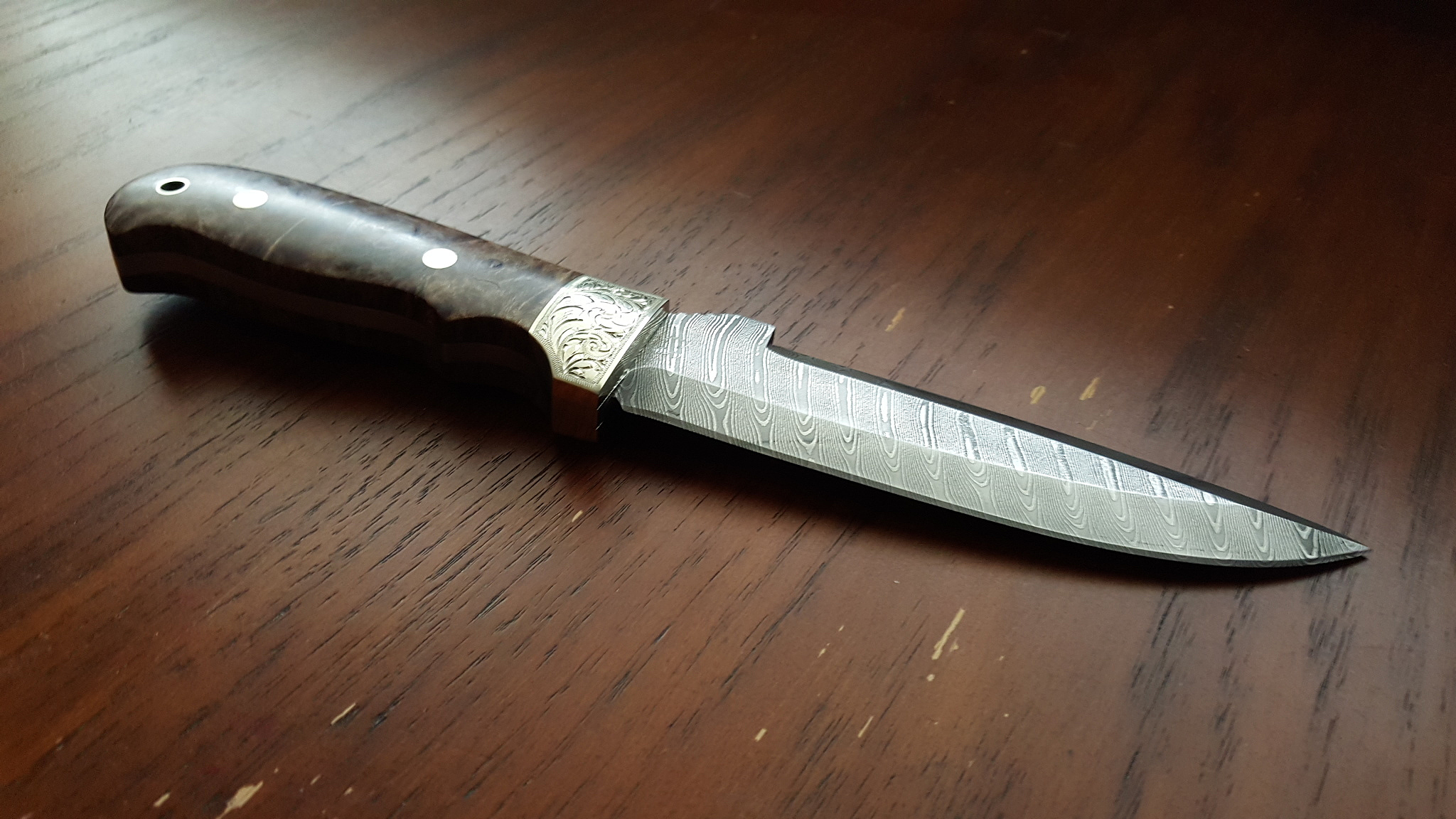 high angle view of kitchen knife on wooden table
