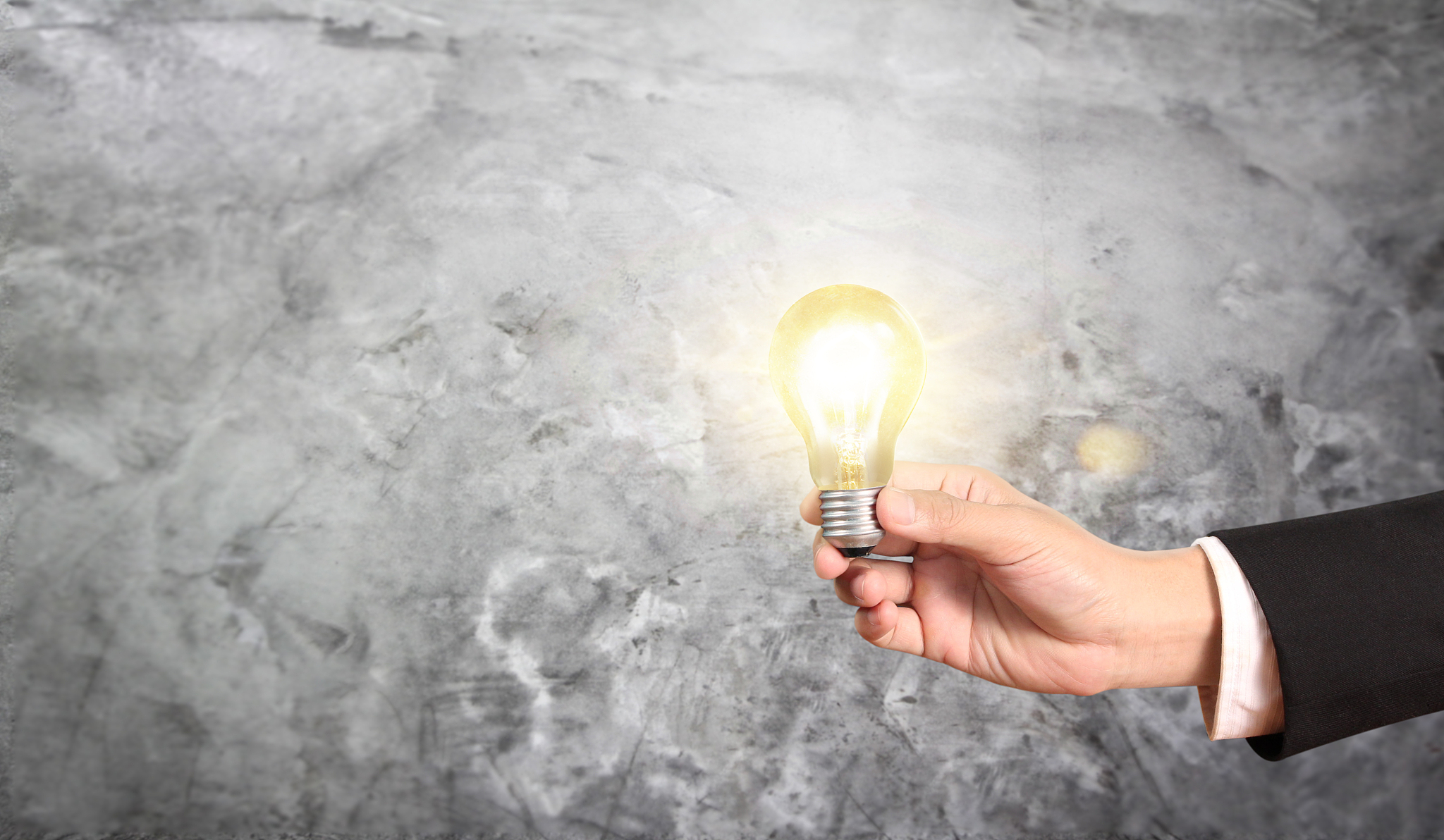 hand of holding illuminated light bulb, innovation inspiration c