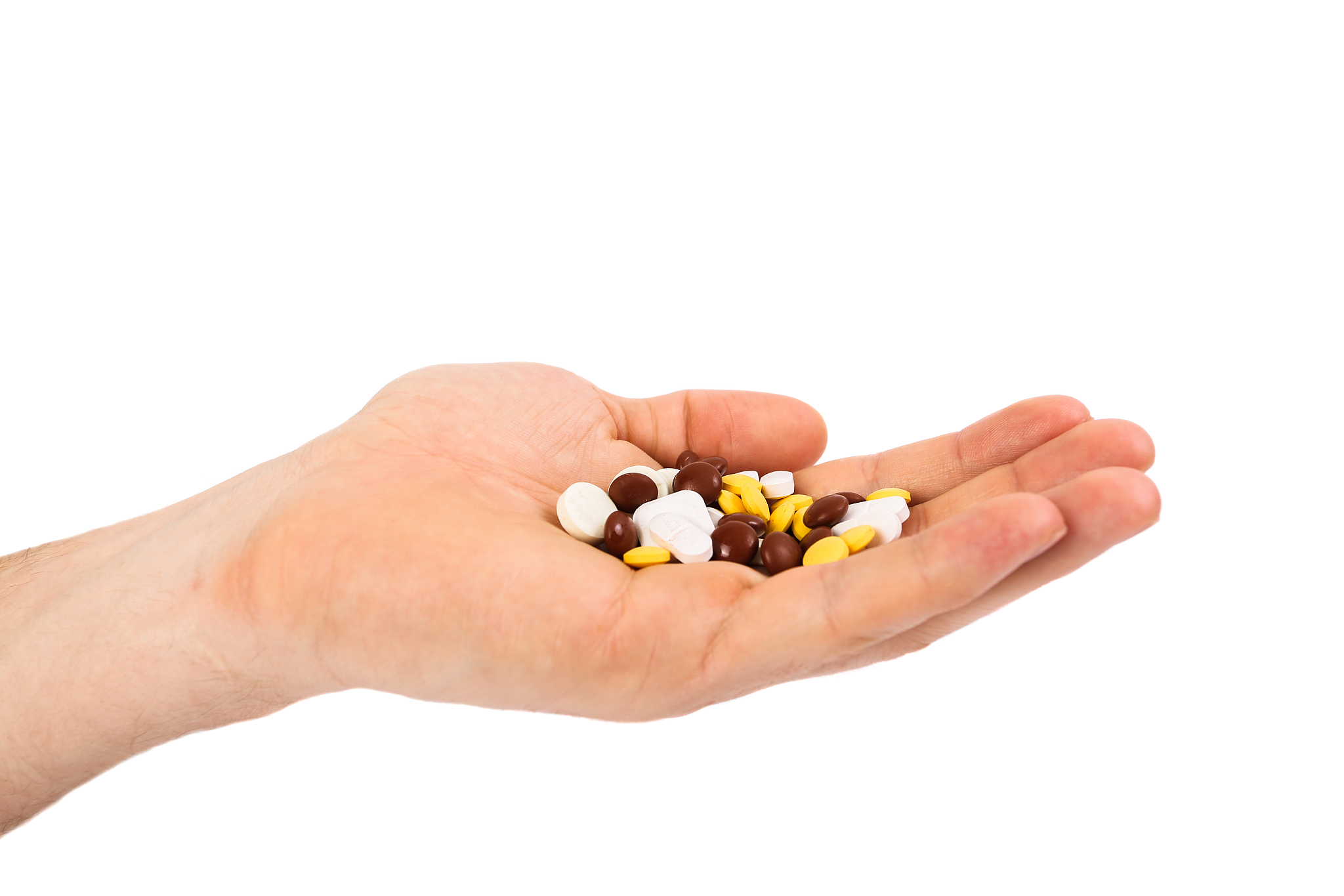 heap of white pills pills medicine in hands