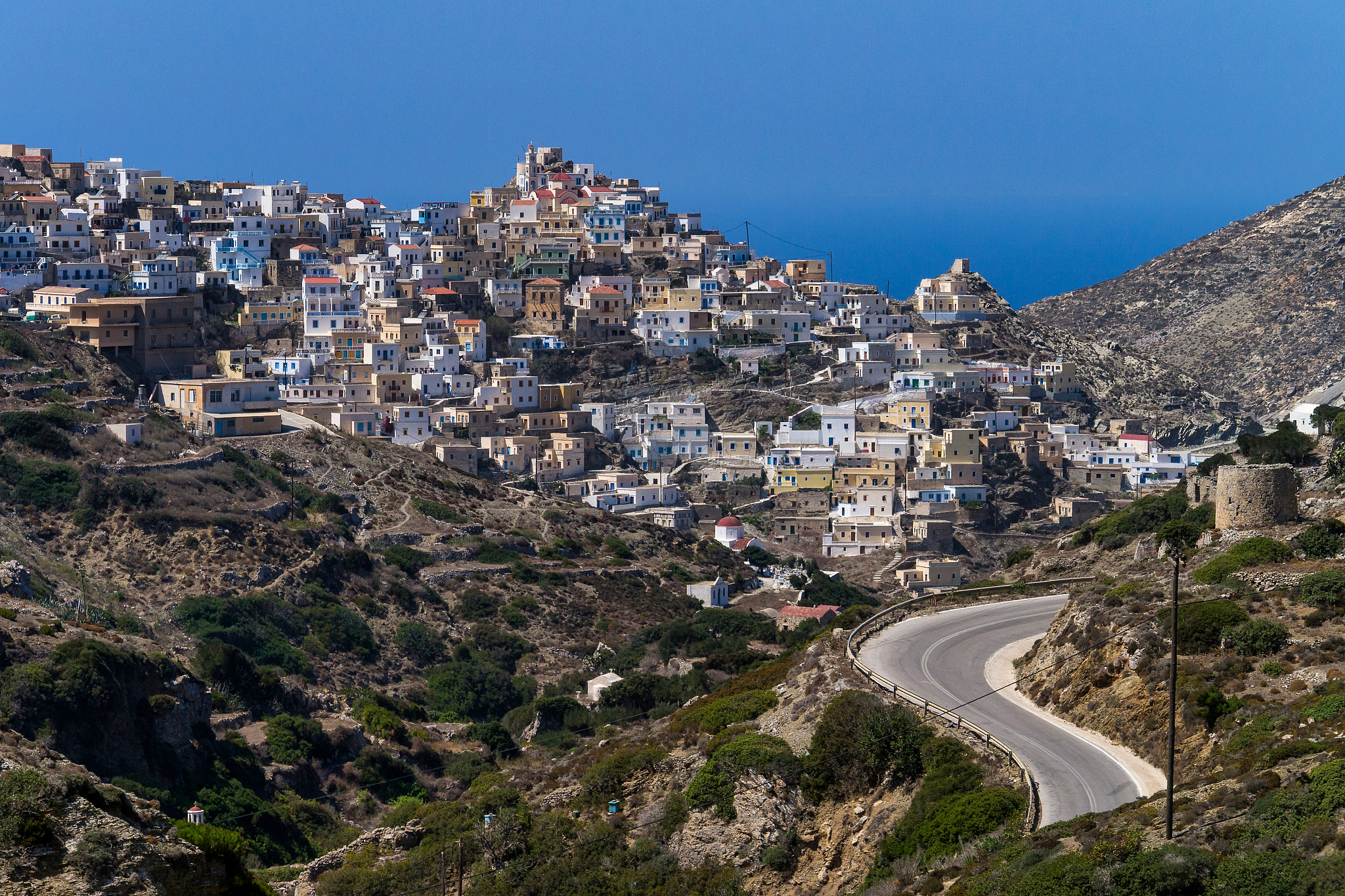 high angle view of townscape against clear blue sky, karpathos, 