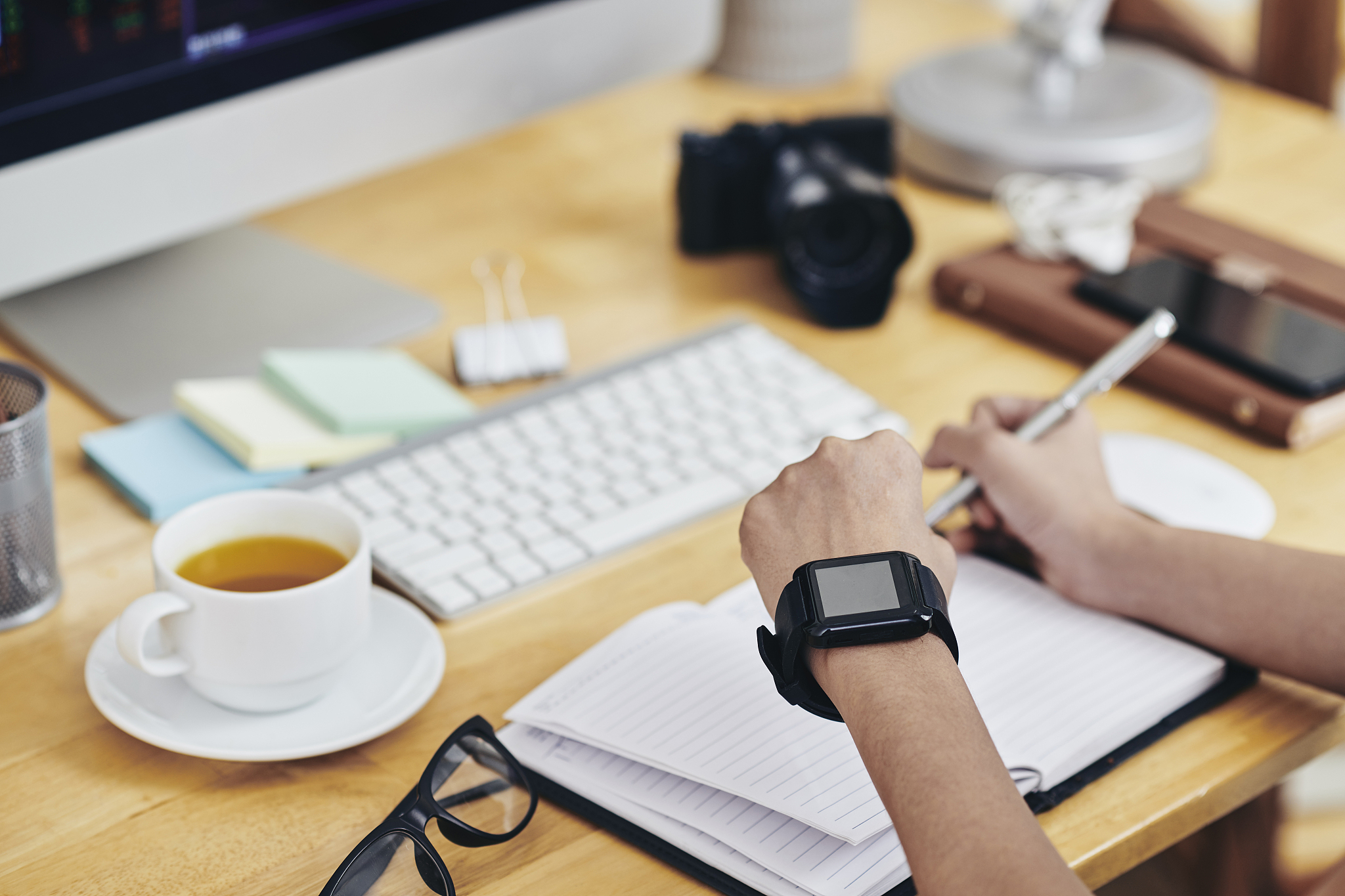 business person checking notifications on smartwatch