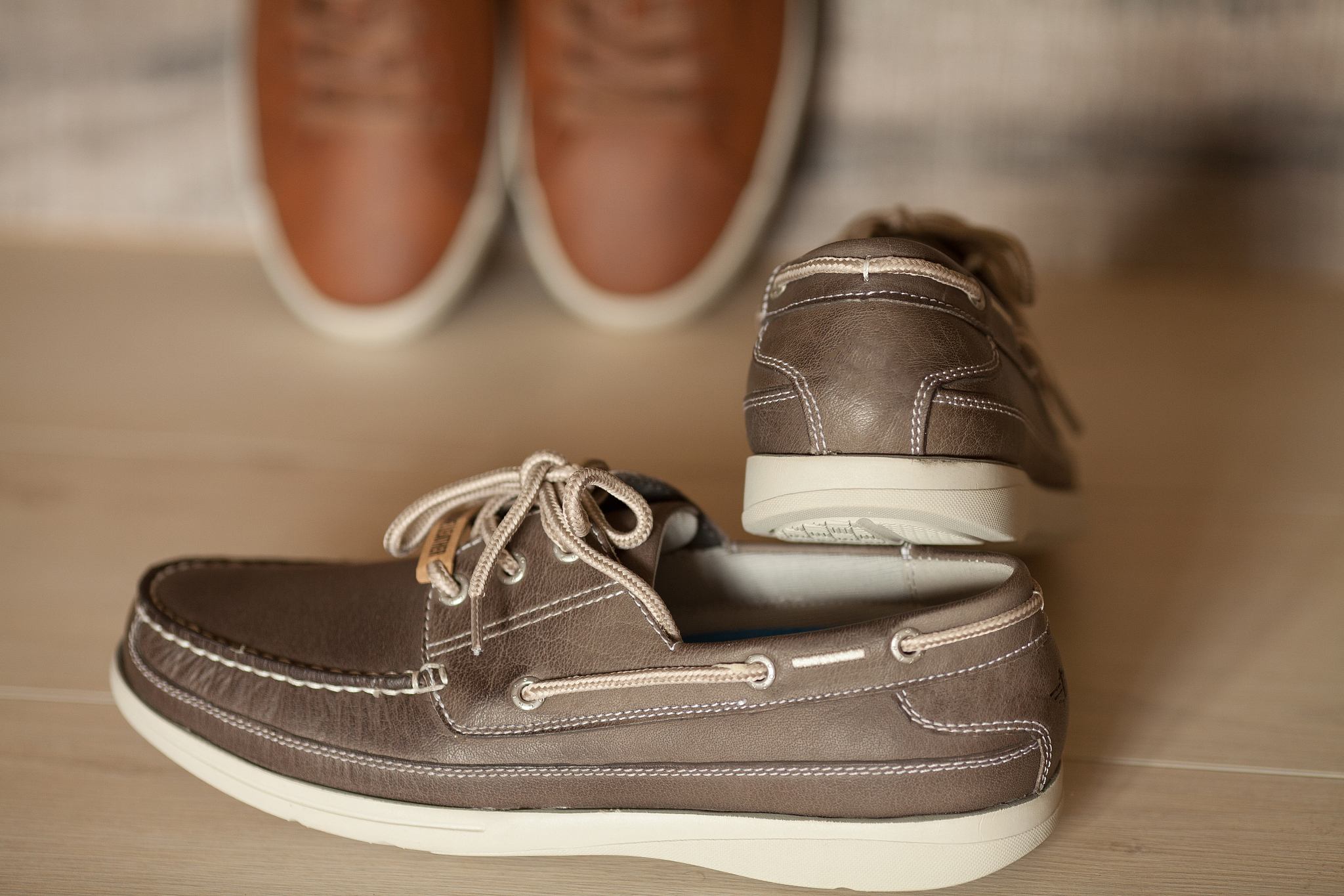 men's brown leather shoes on rustic wooden background, beauty an