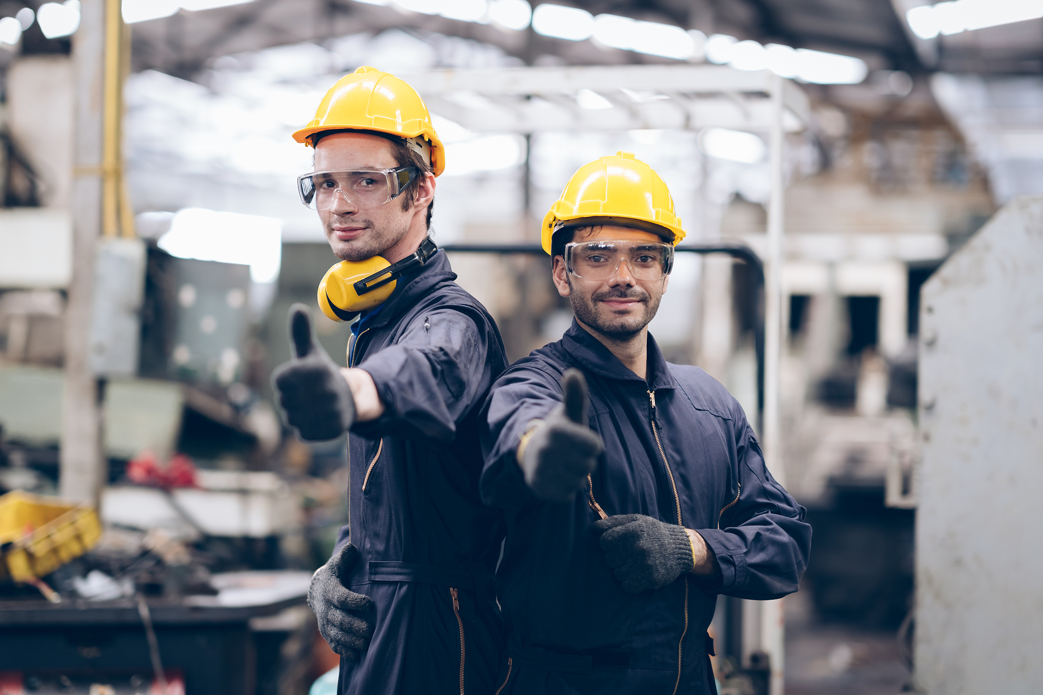 good job! technician and partnership smile and lokking camera at