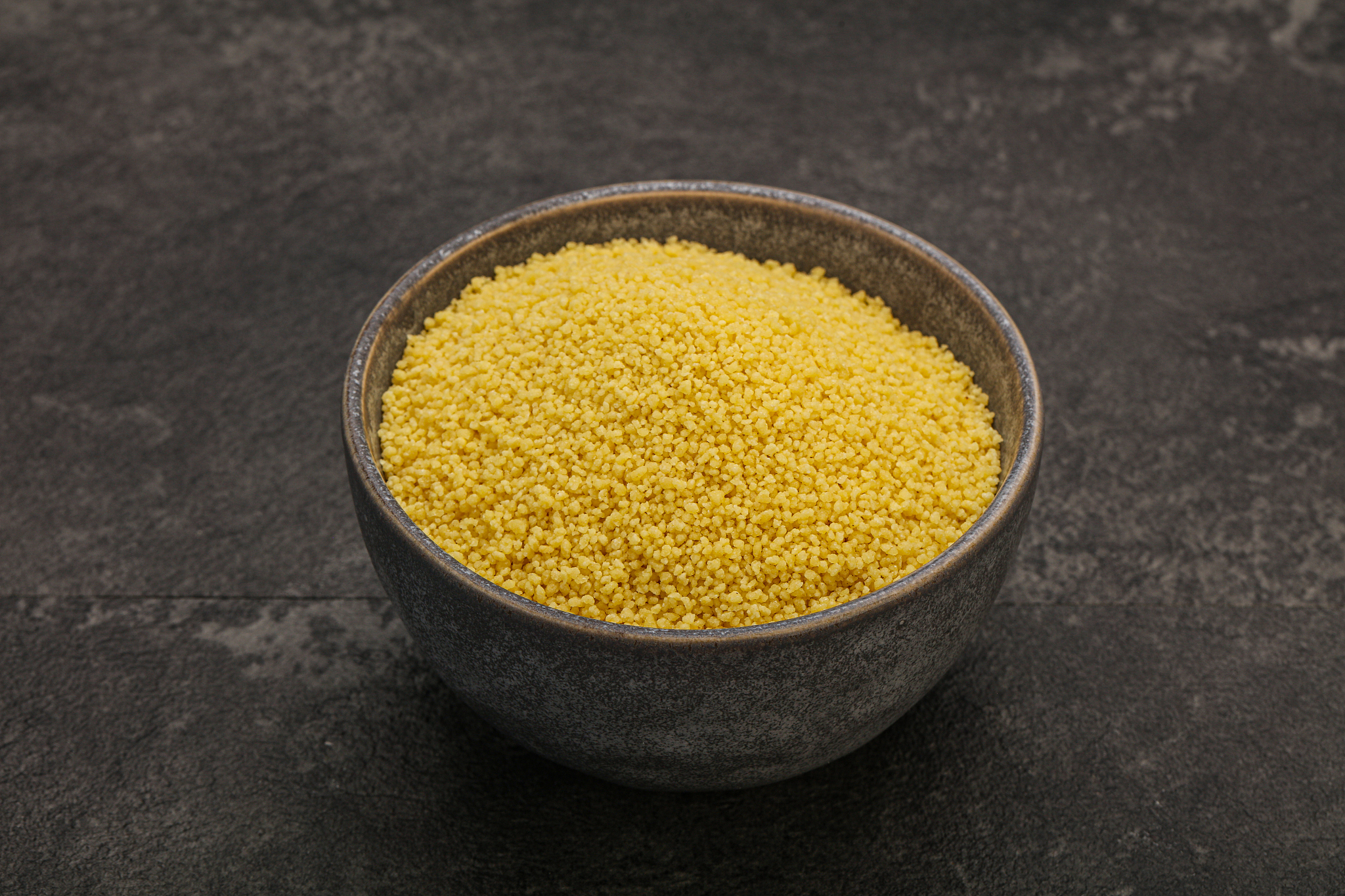 raw cous cous heap in the bowl