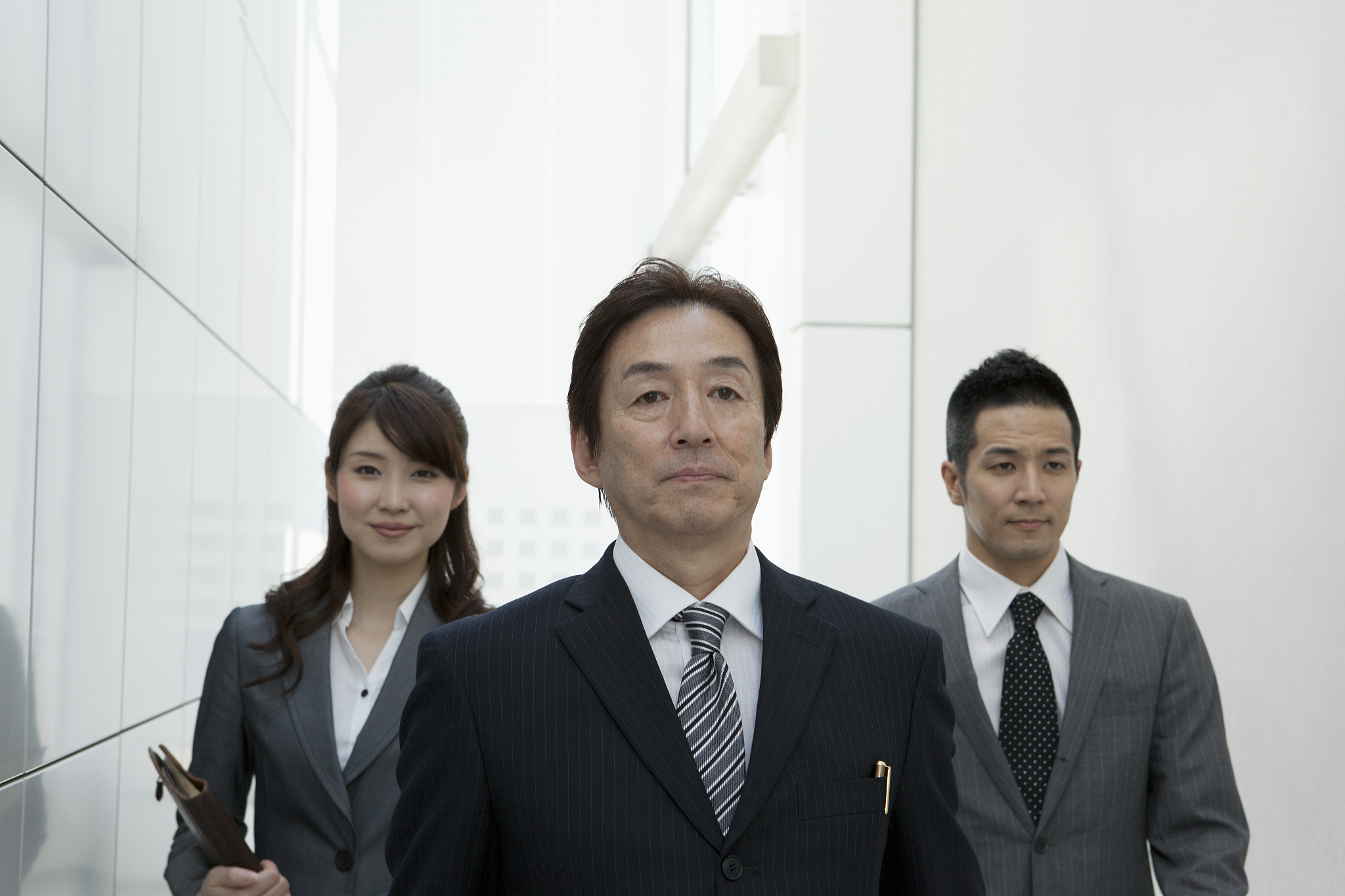 business scene three persons who move in the company