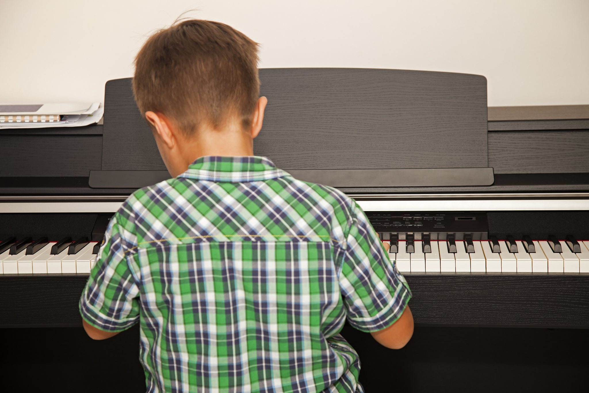 little boy playing piano