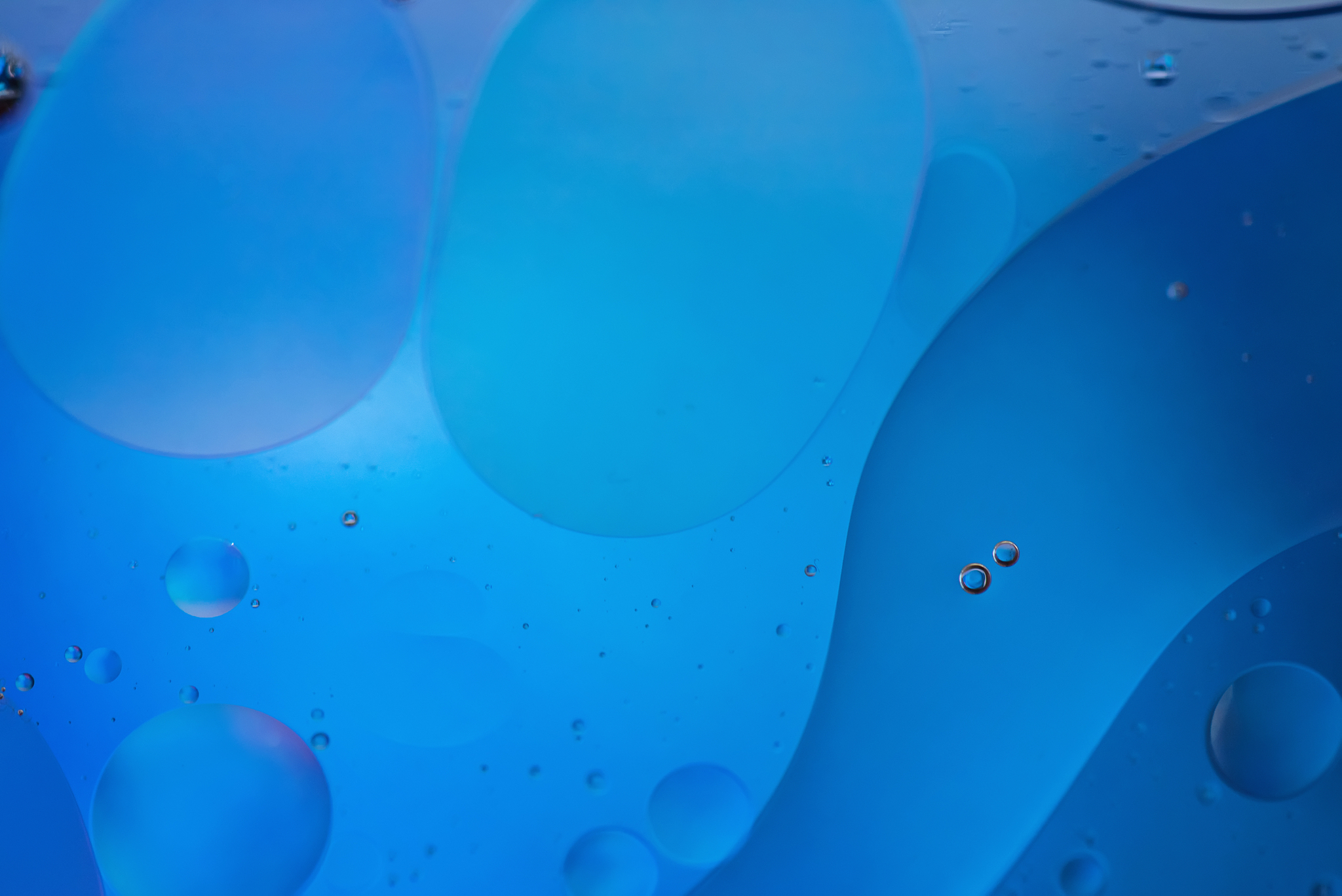 blue abstract background picture made with oil, water and soap