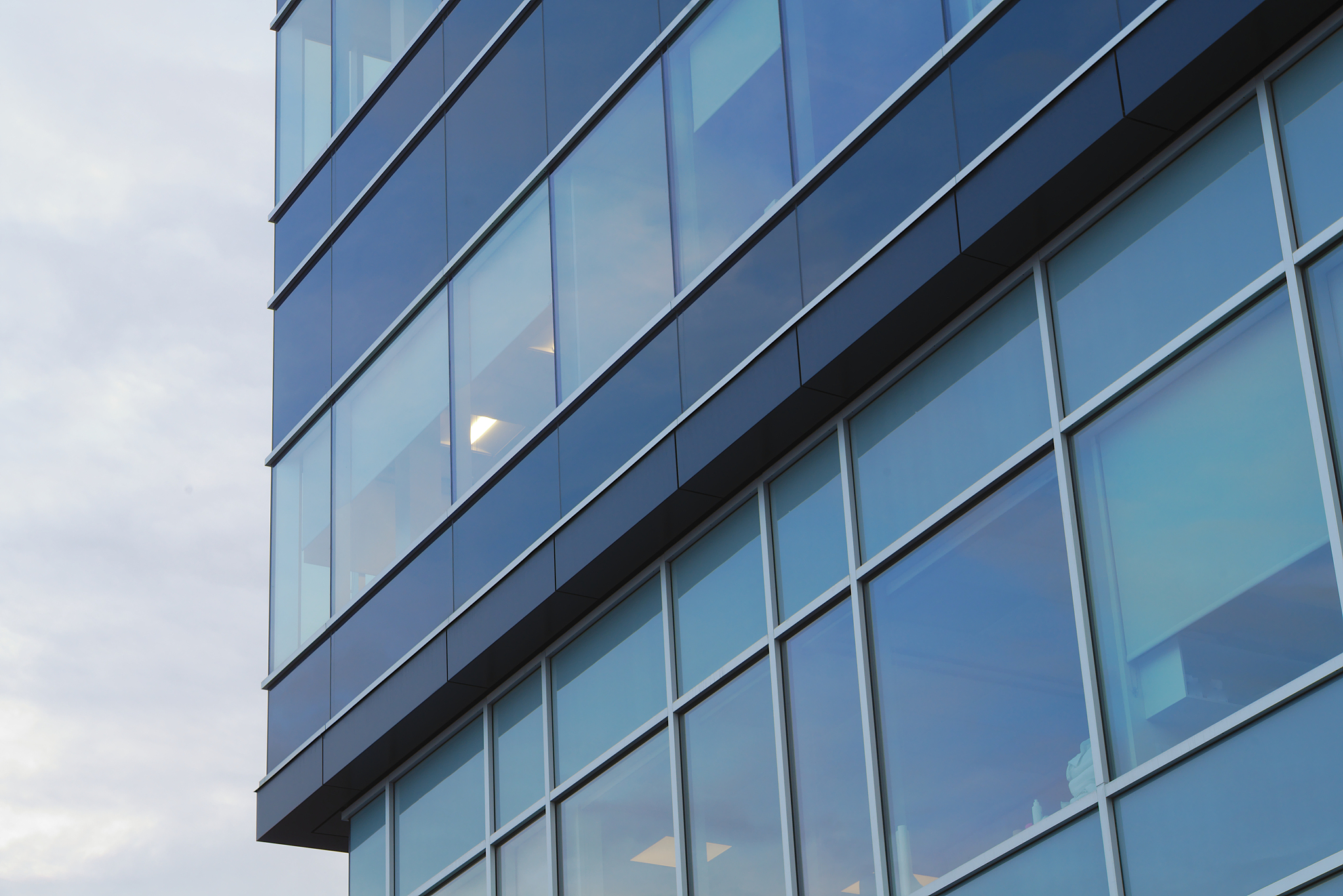 office tower blue building corner glass windows skyscraper archi