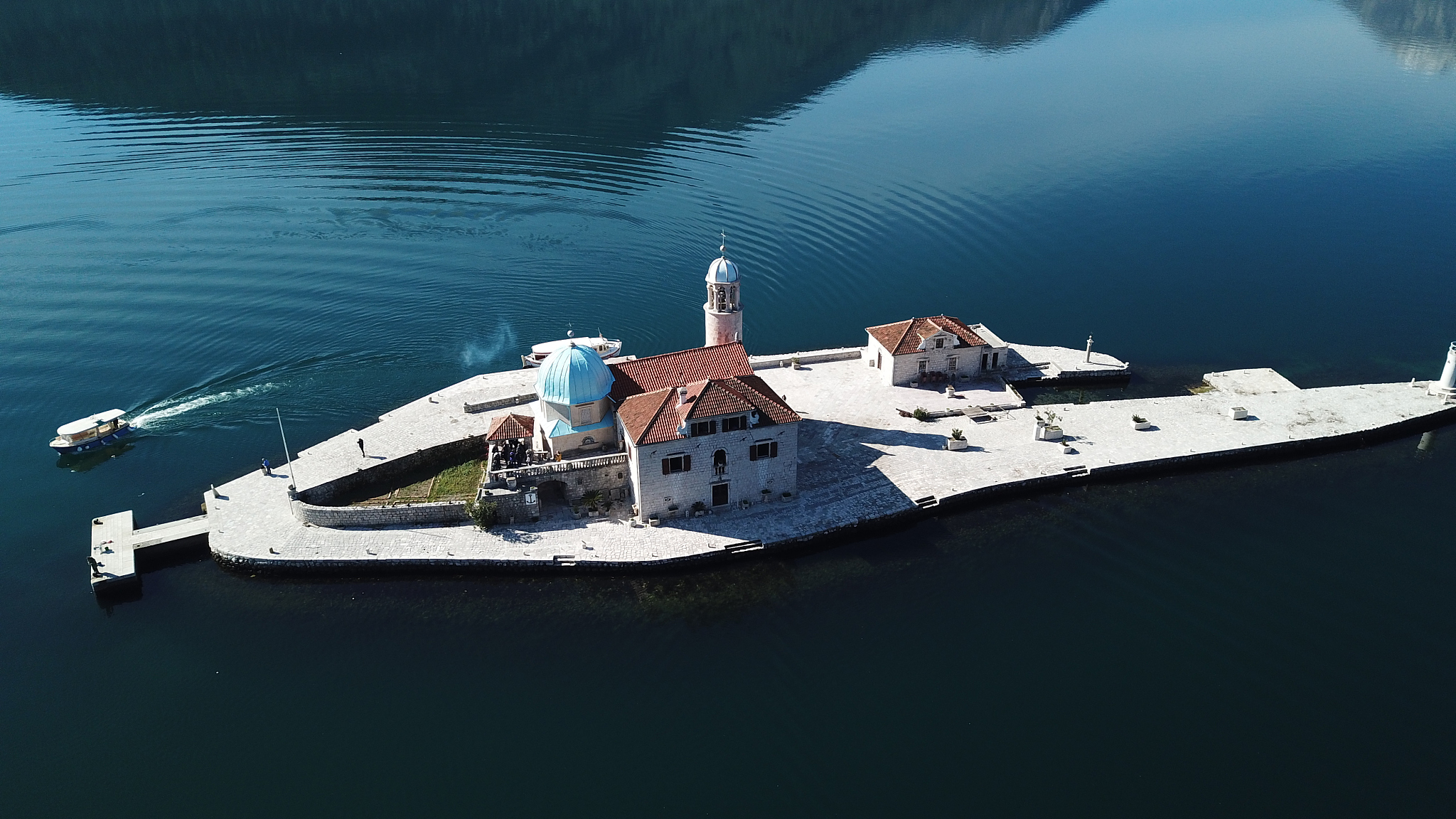 high angle view of buildings by sea