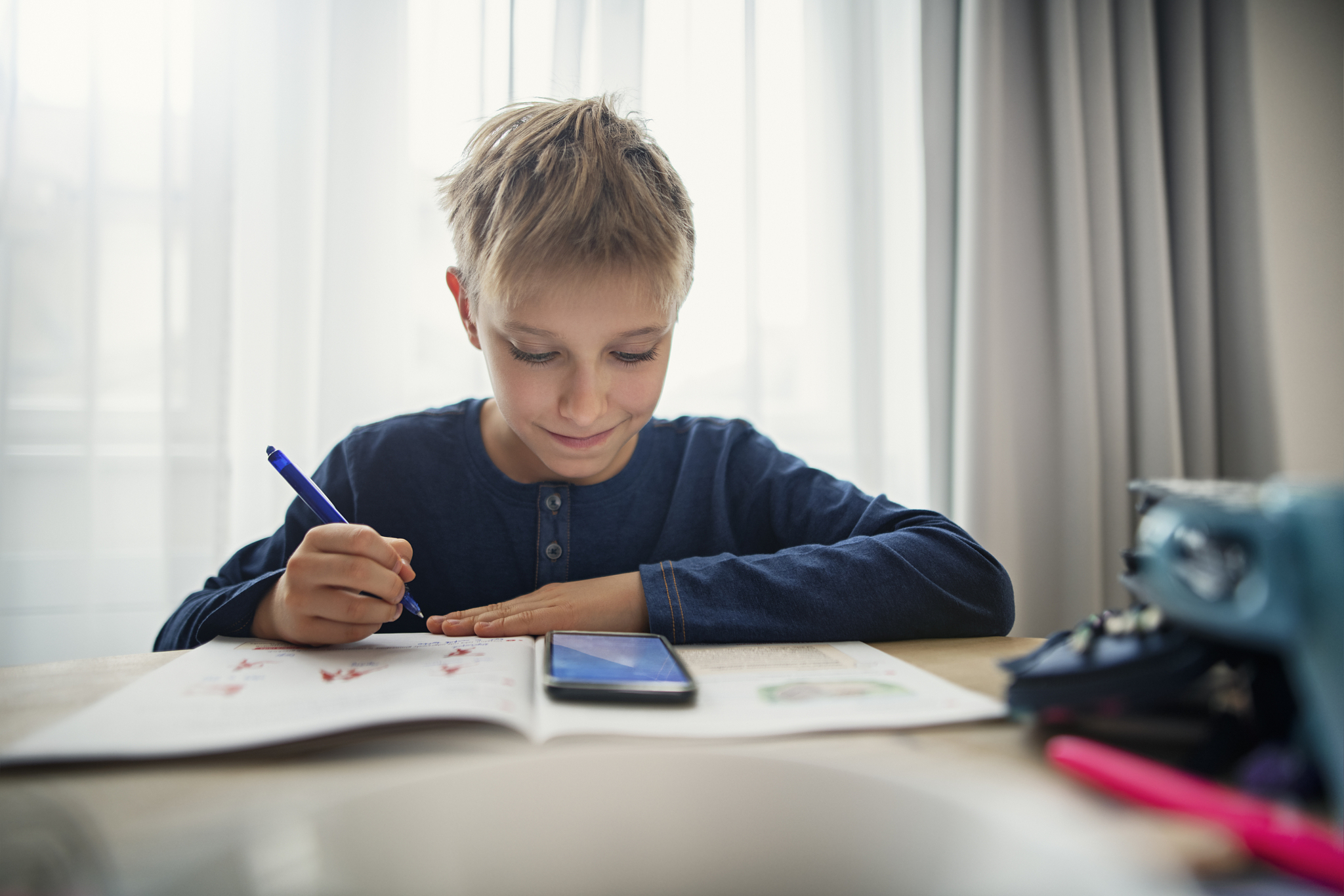 little boy doing homework at home
