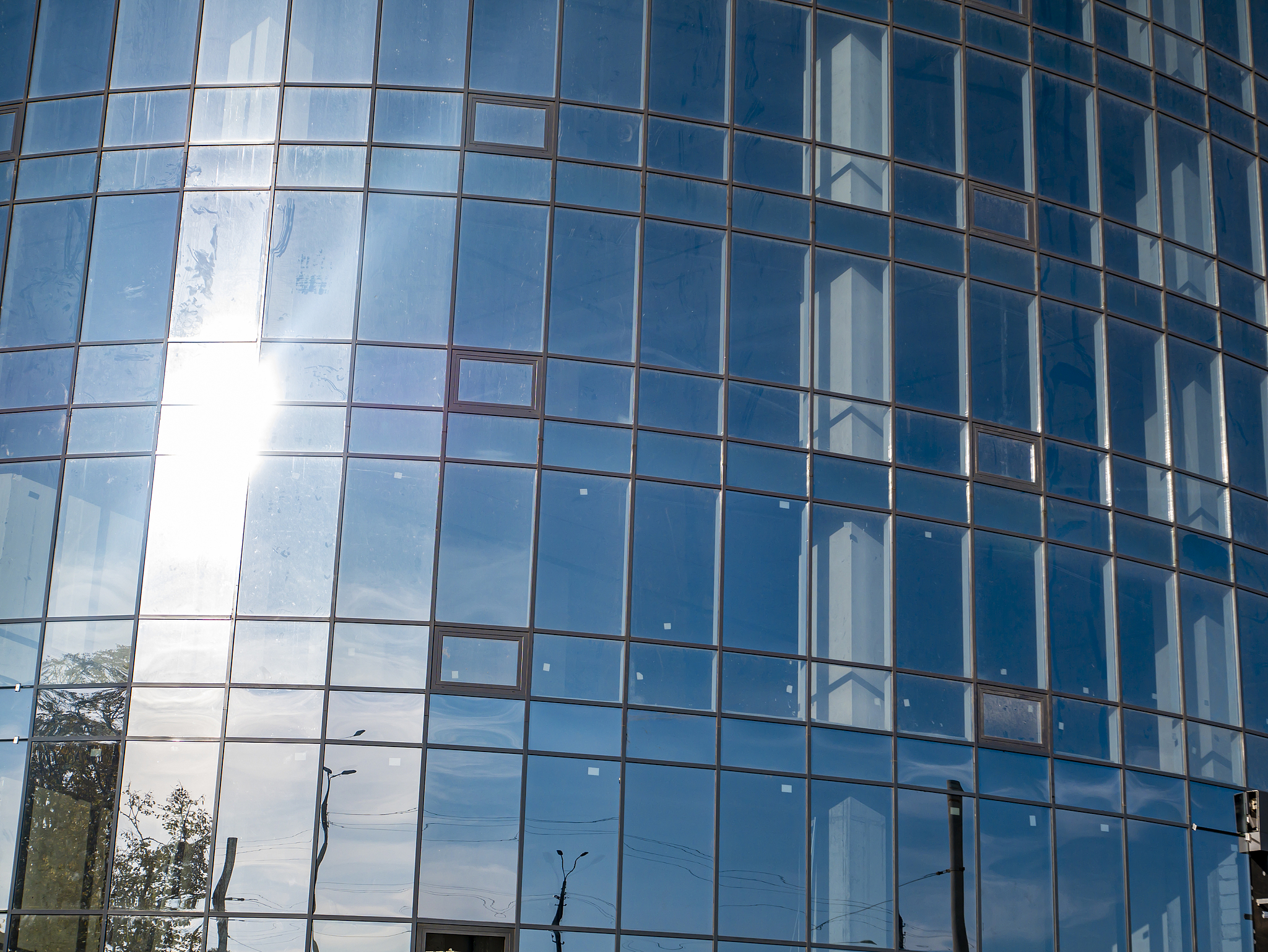 windows of an office building in the sun.