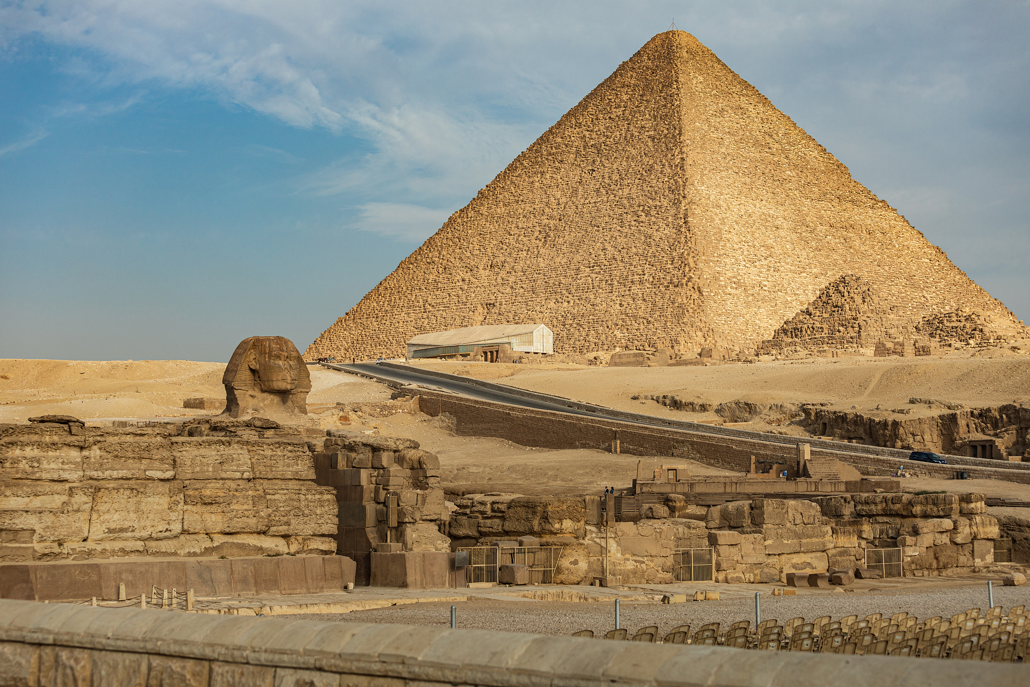 great sphinx of giza in front of pyramids