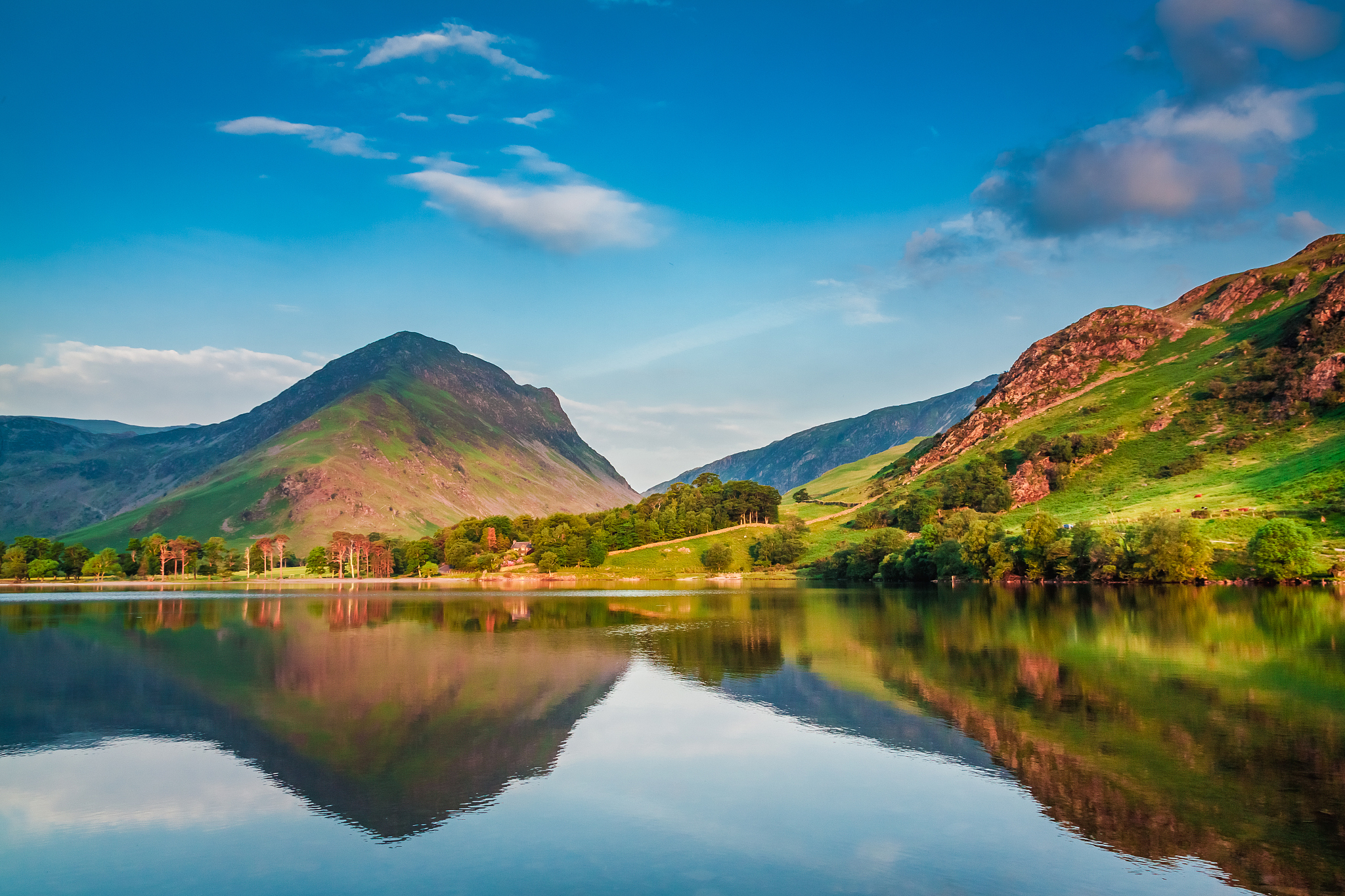 beautiful sunset at lake in district lake, uk