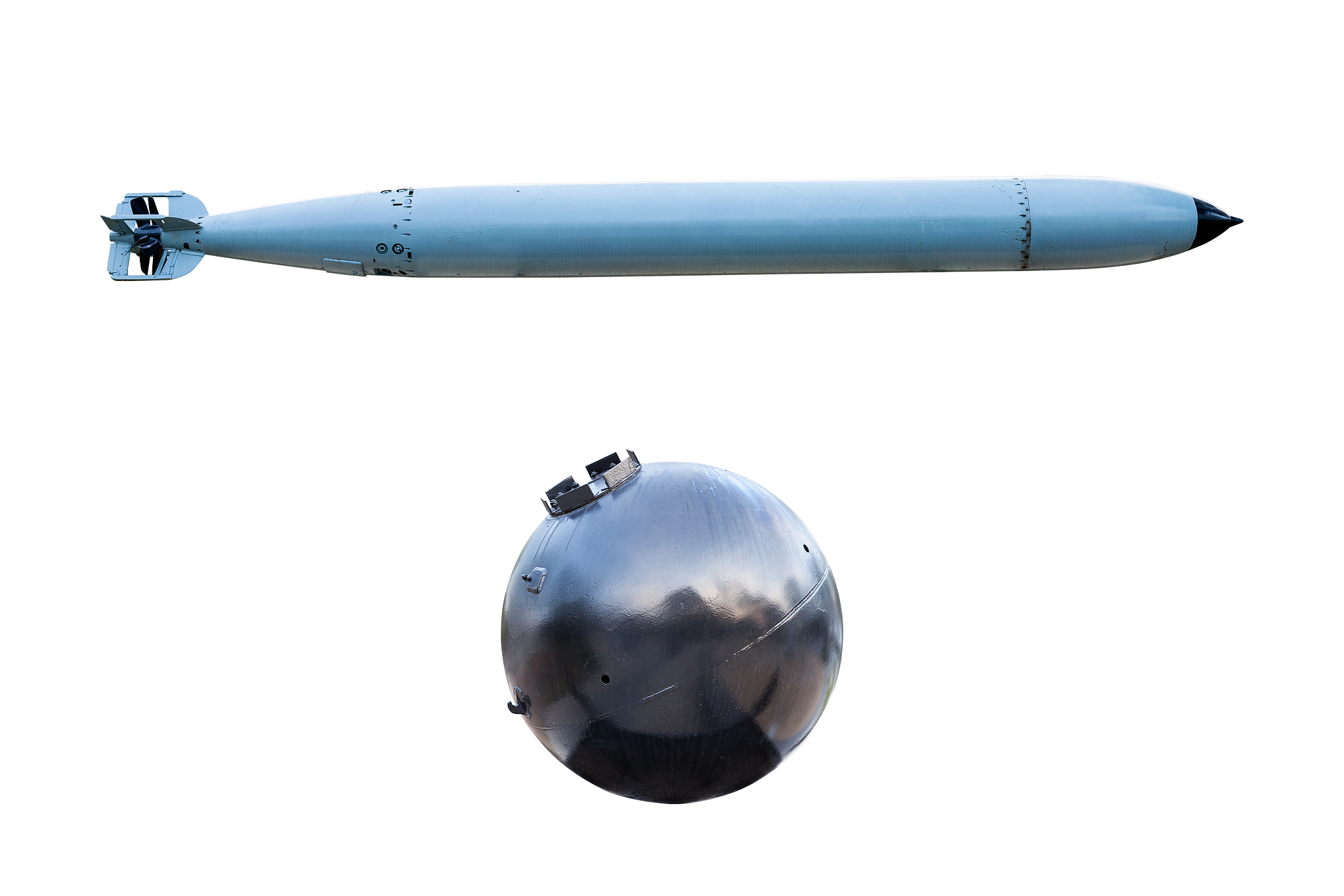 old torpedoes and old naval bomb on white background.