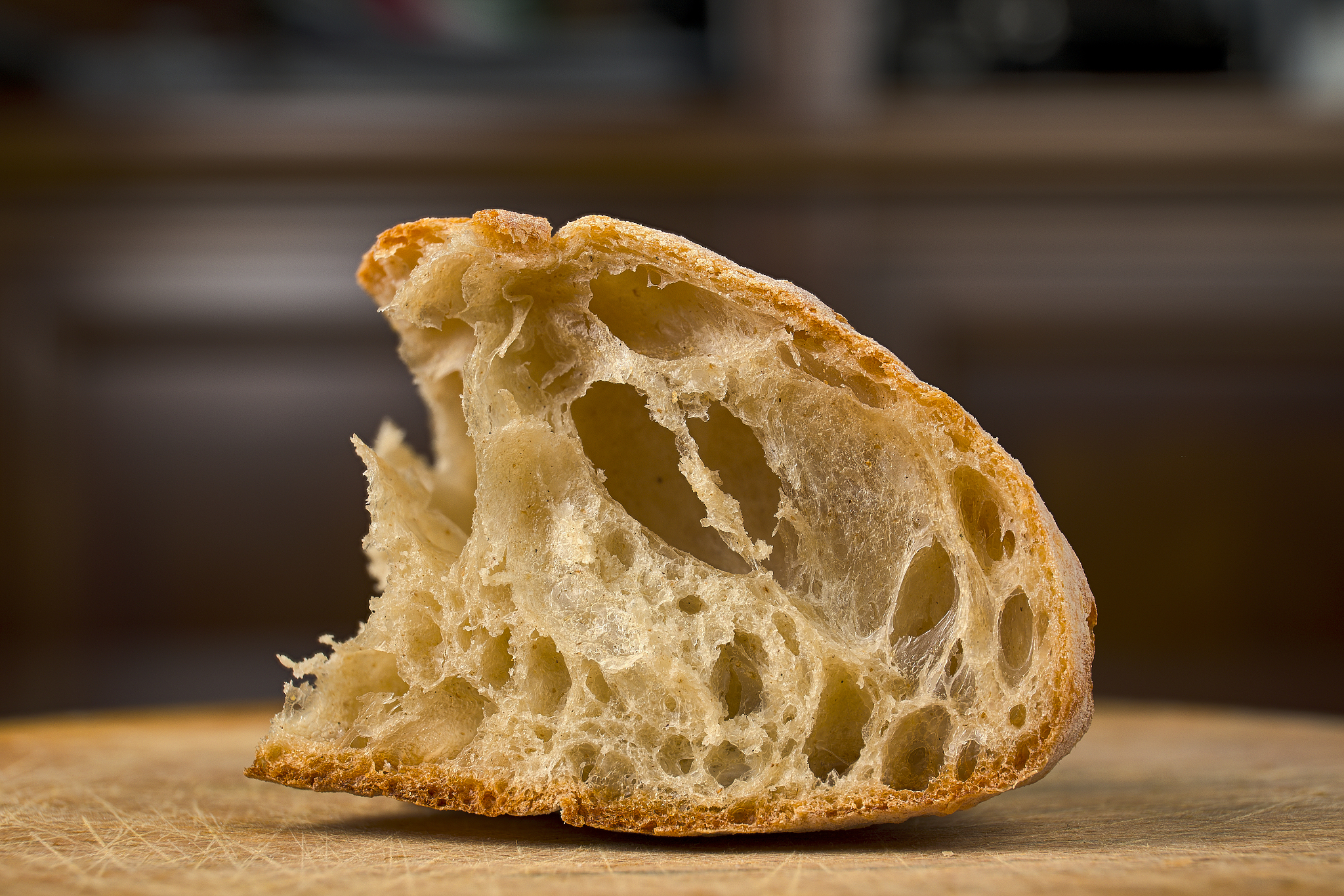 piece of artisan bread on a wooden board