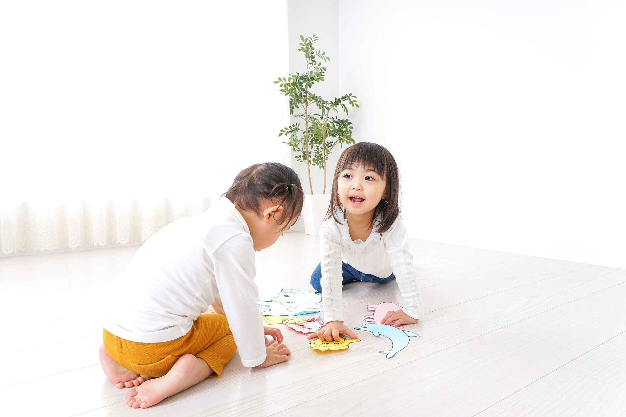 two children playing in room