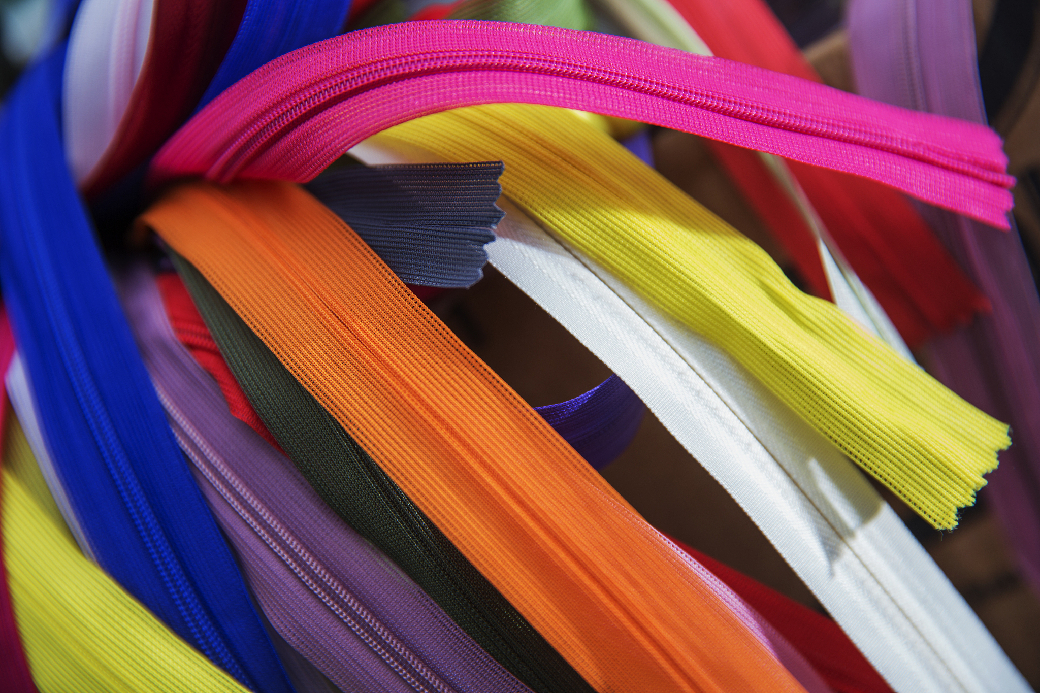 bunch of multicolored zippers