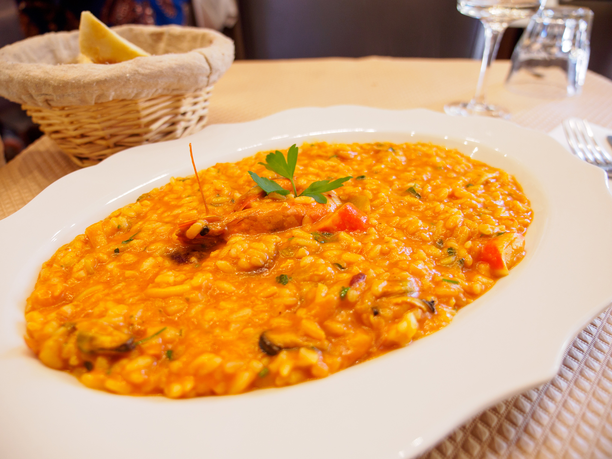 seafood shrimp risotto with bread, paris, france