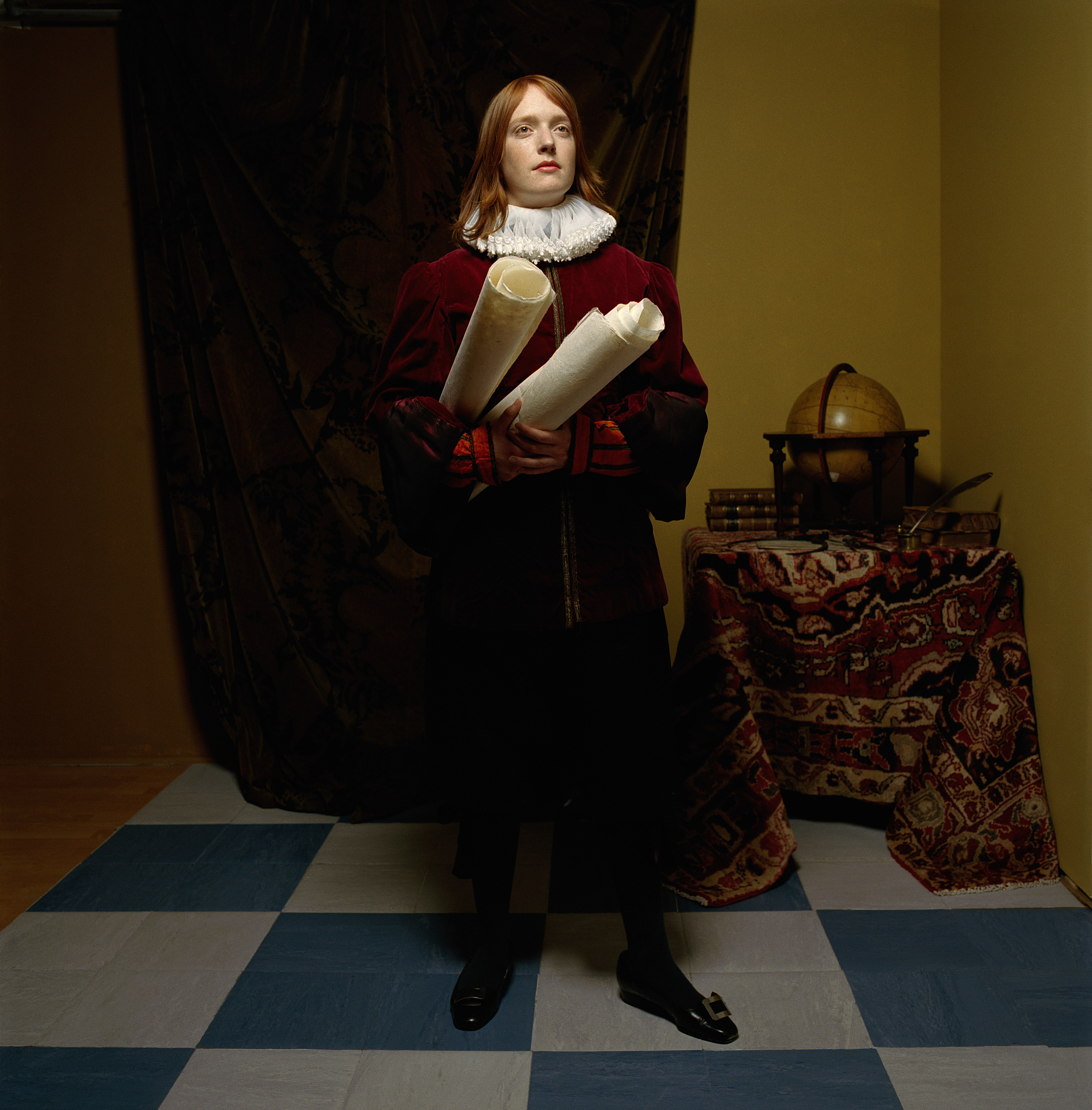 young woman wearing scholar outfit, holding scrolls