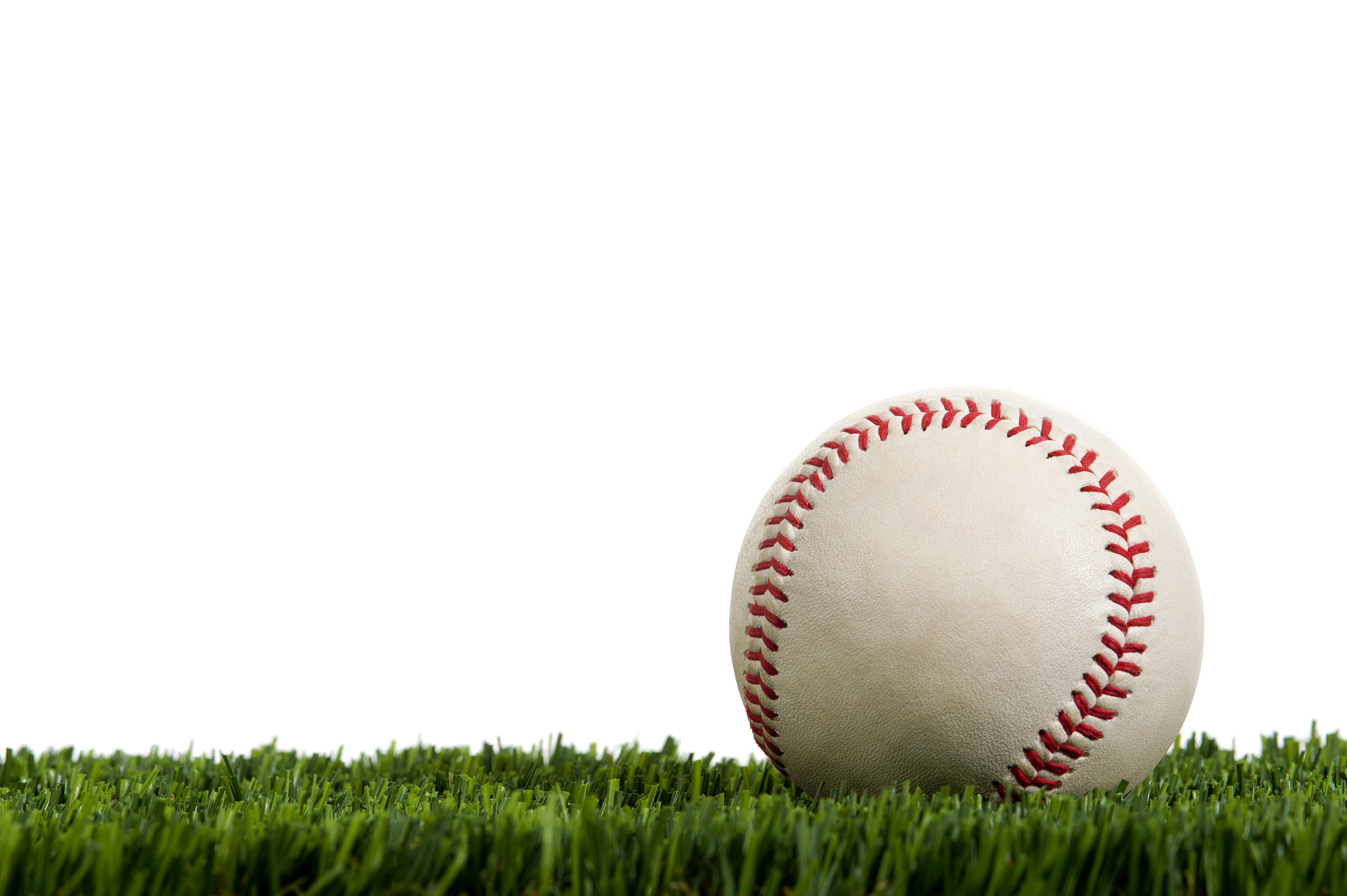 baseball in grass against a white background
