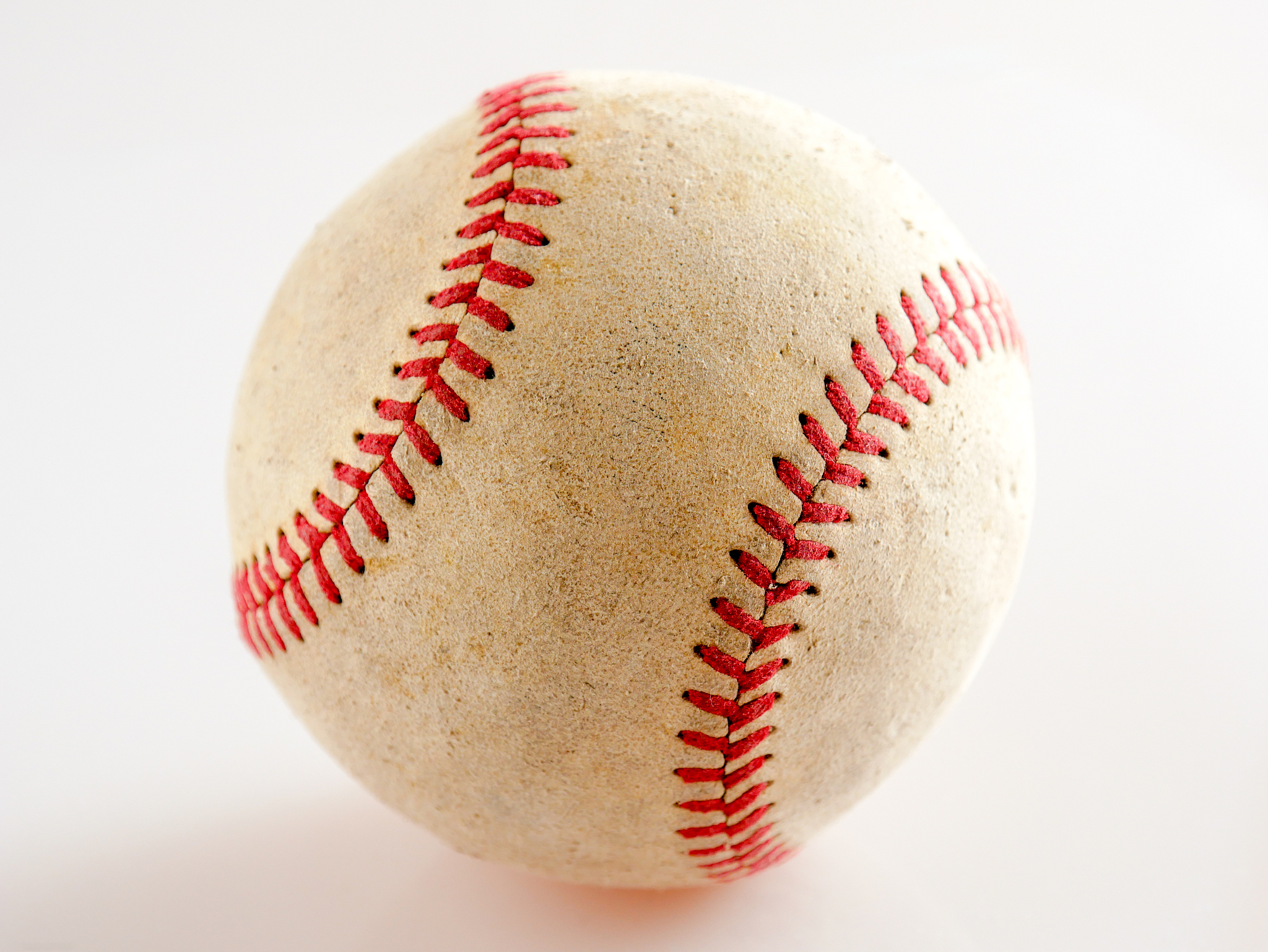 sports equipment old baseball on white background