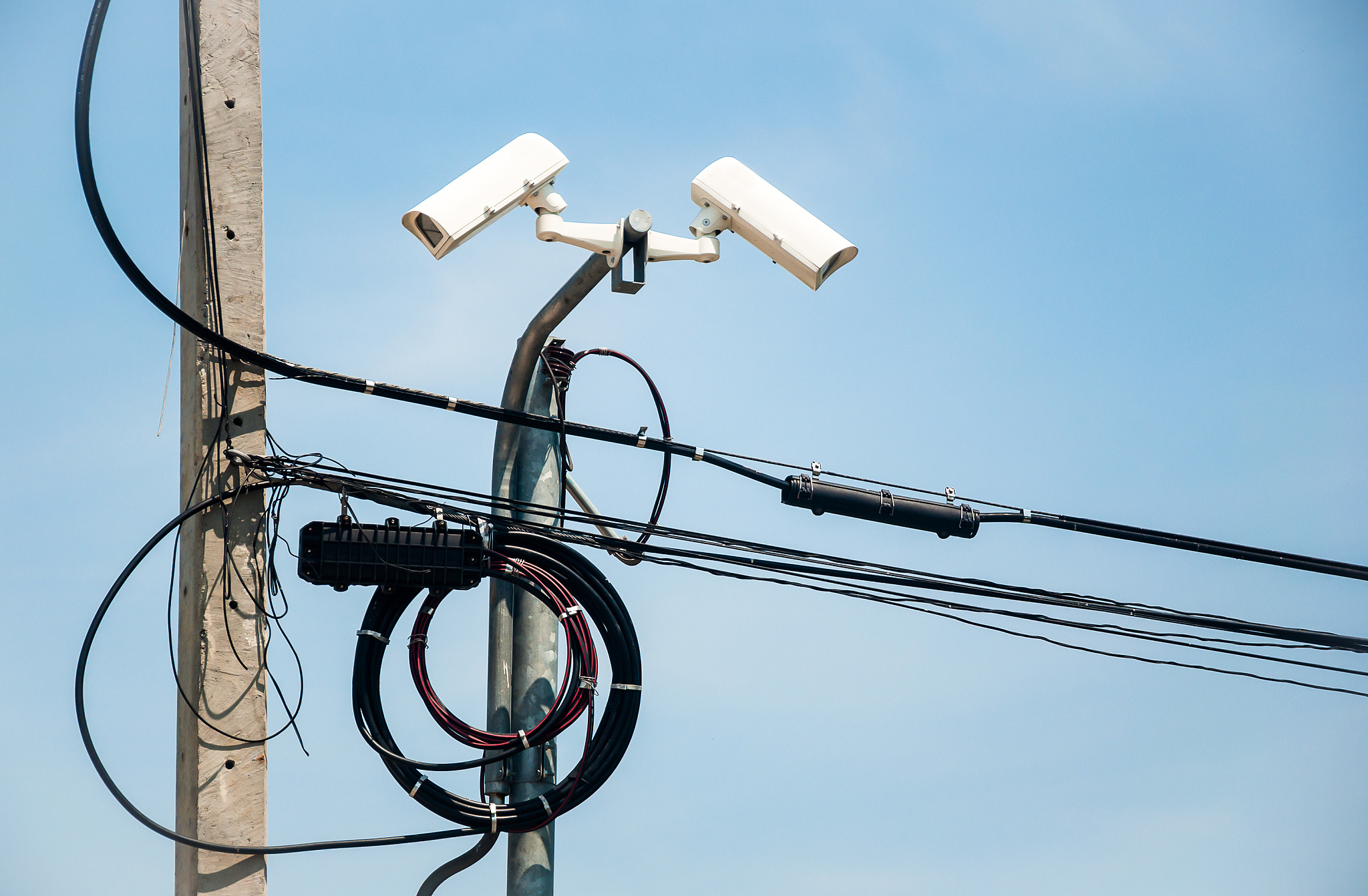 the surveillance cameras on blue background