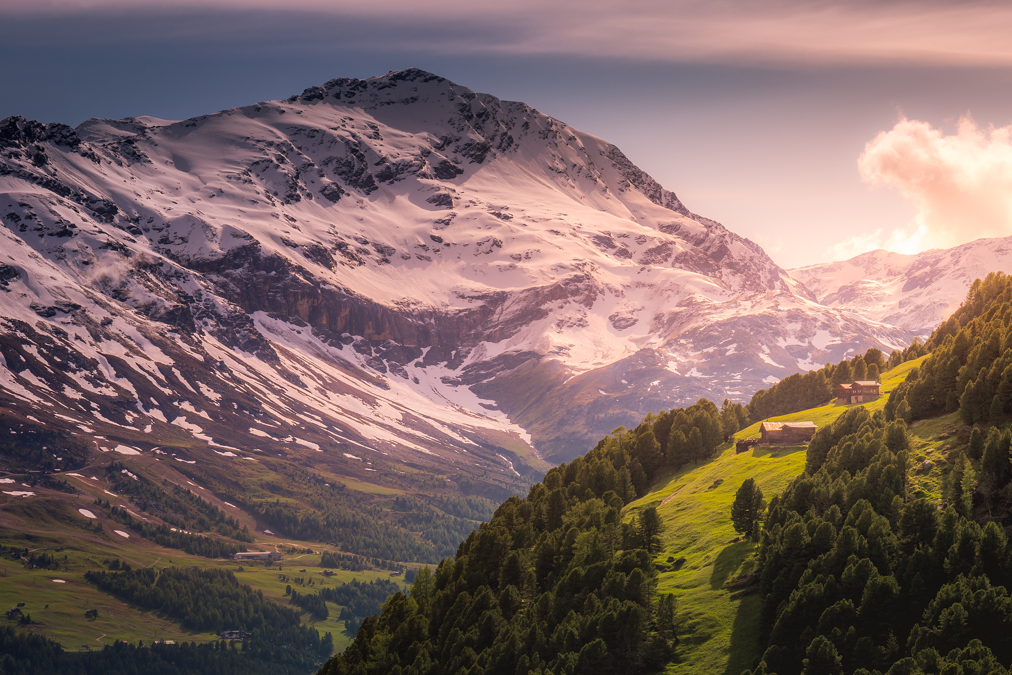 snowcapped mountain in stelvio national park with chalets and ba