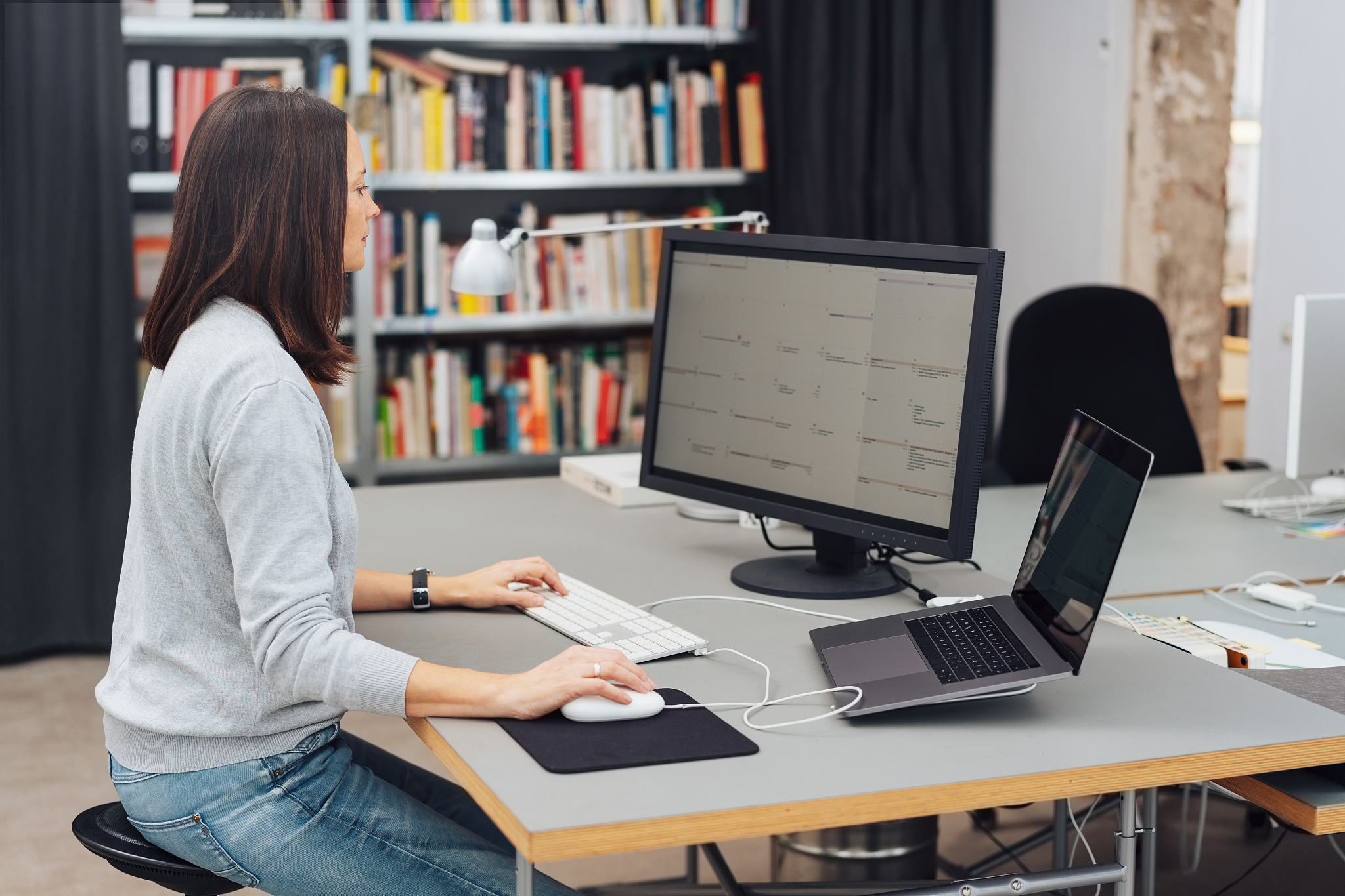 woman works on computer in office
