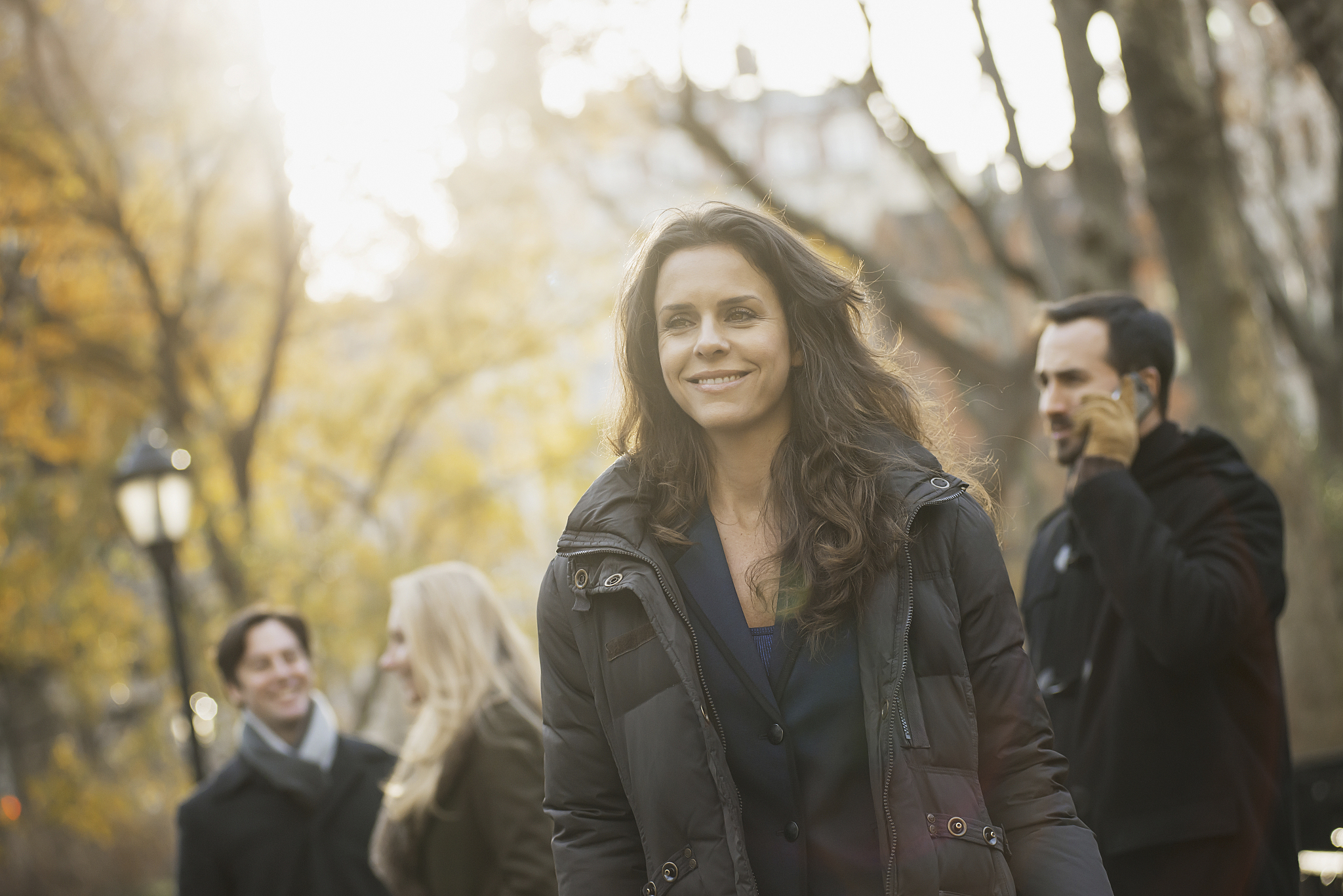 adult group in urban park,woman in front