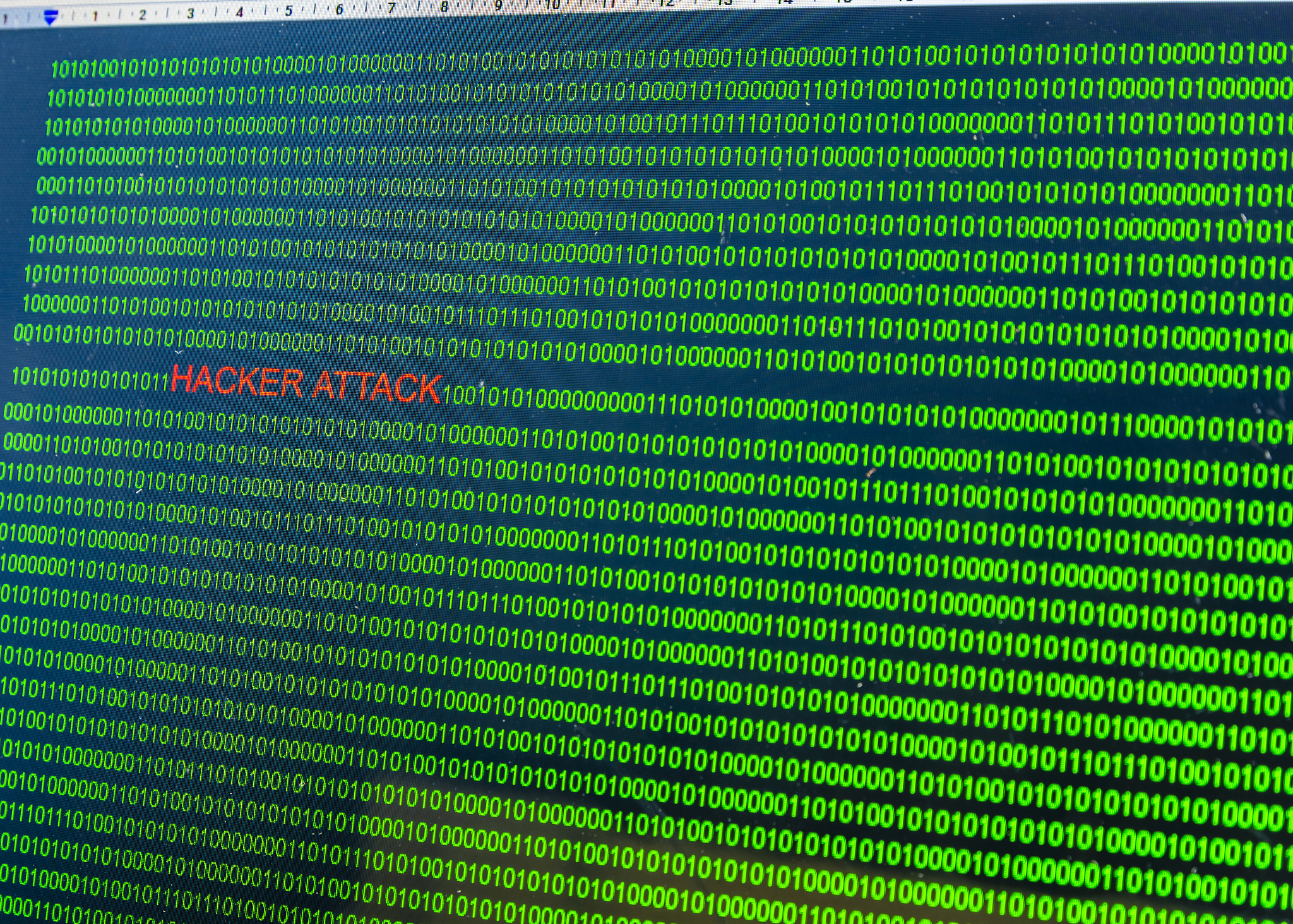 red inscription hacker attack in malicious computer code written