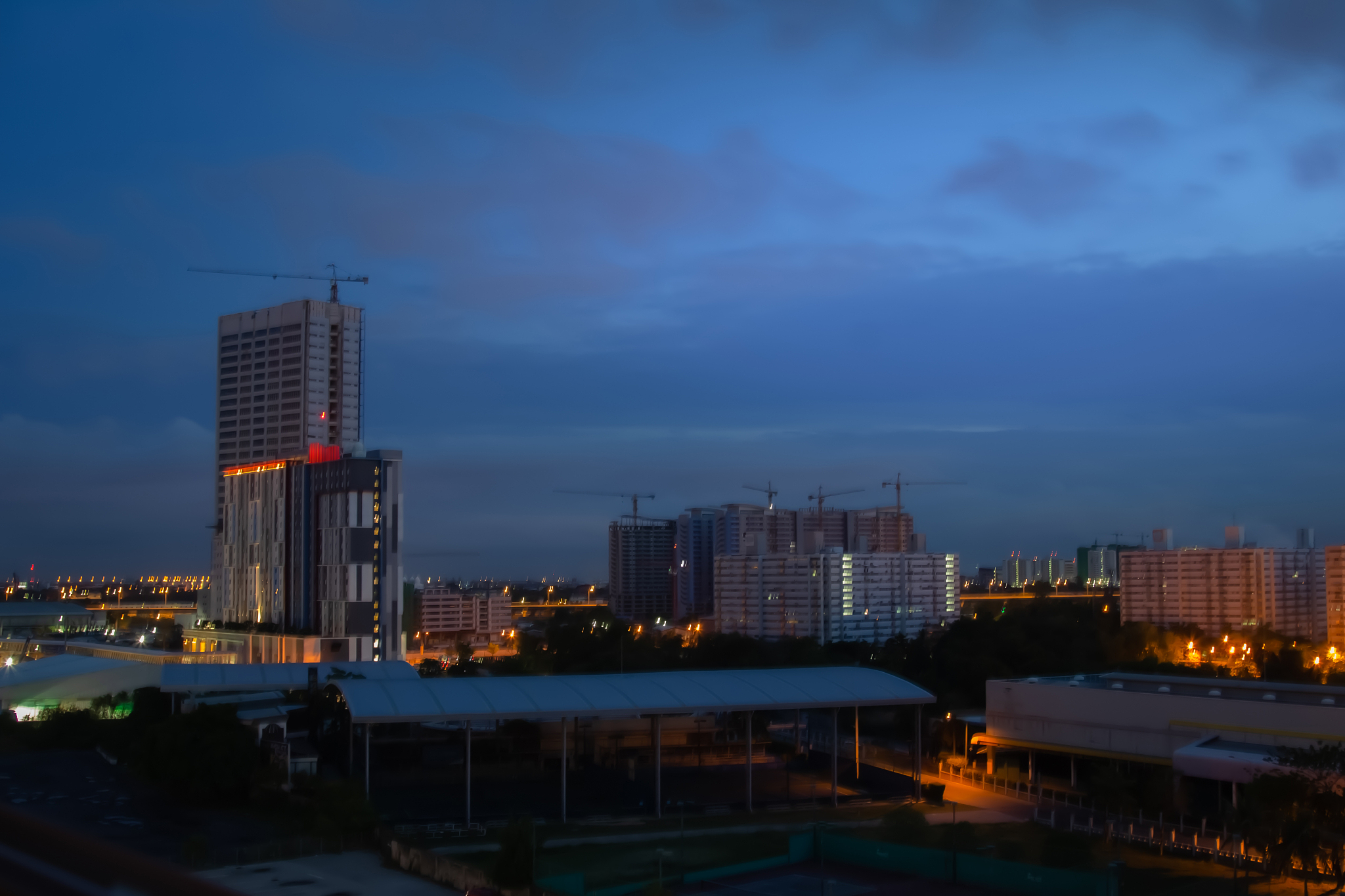 abstract blur skyline sunrise in the morning on city rooftop vie