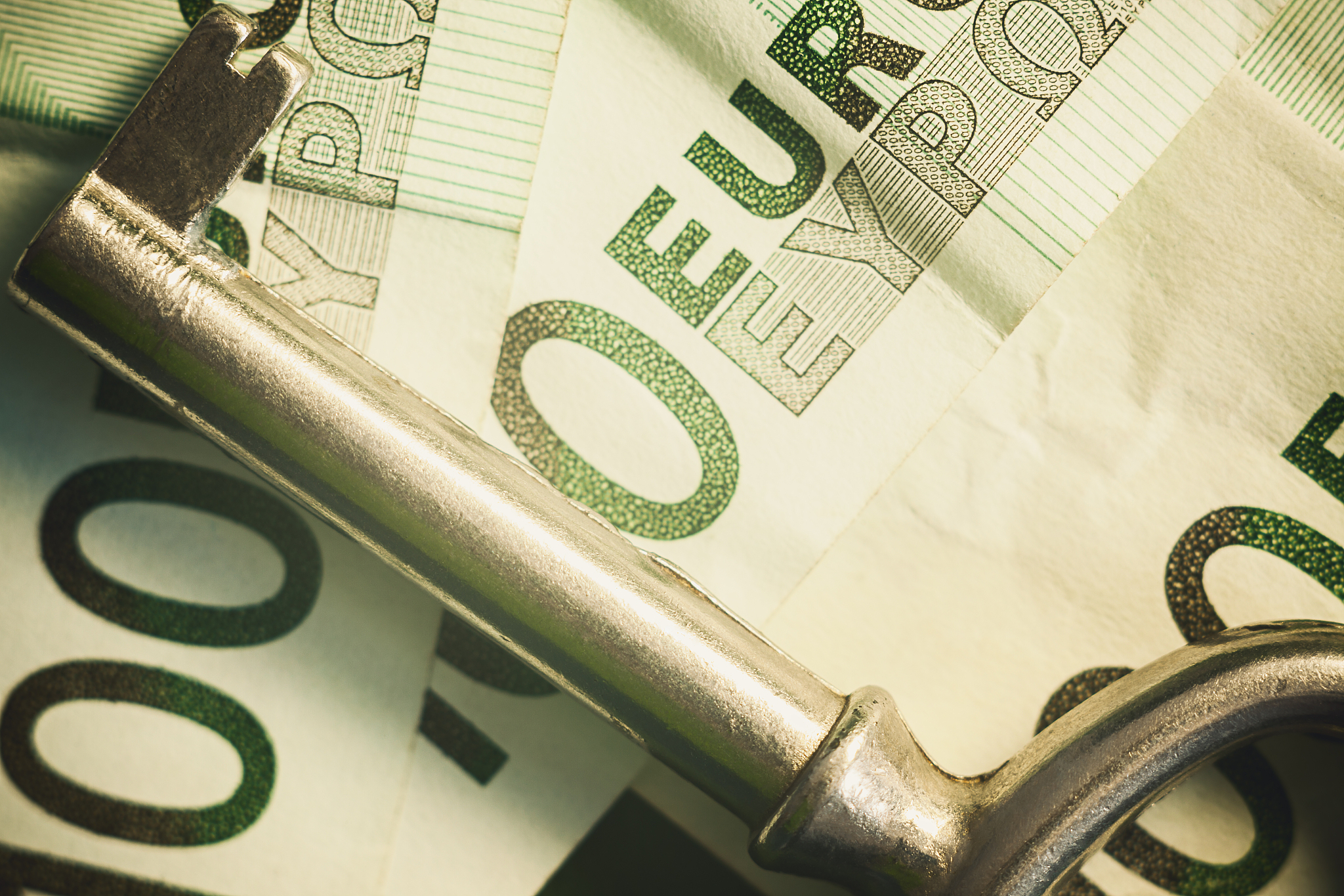 euro banknotes and key