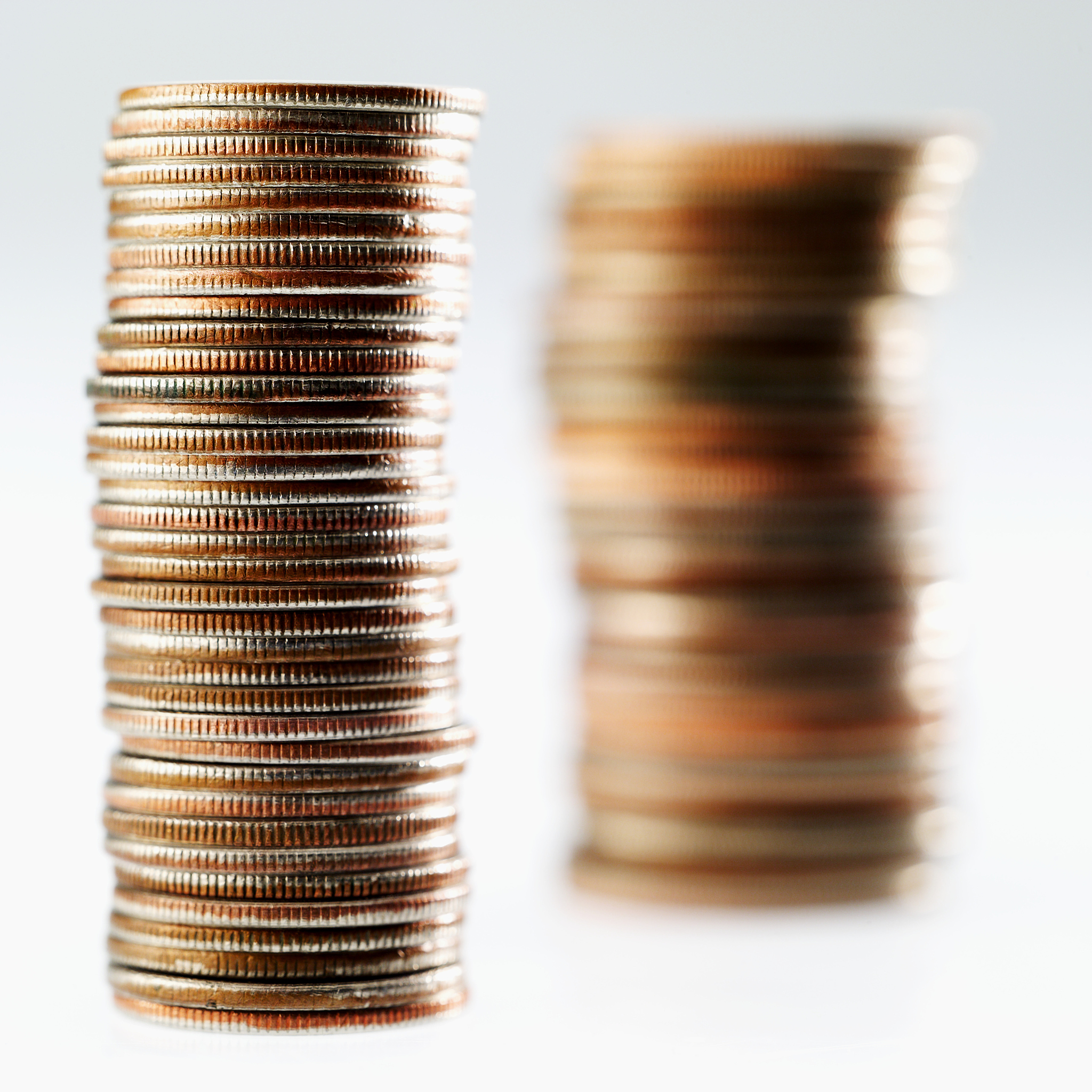 close-up of two stacks of american coins