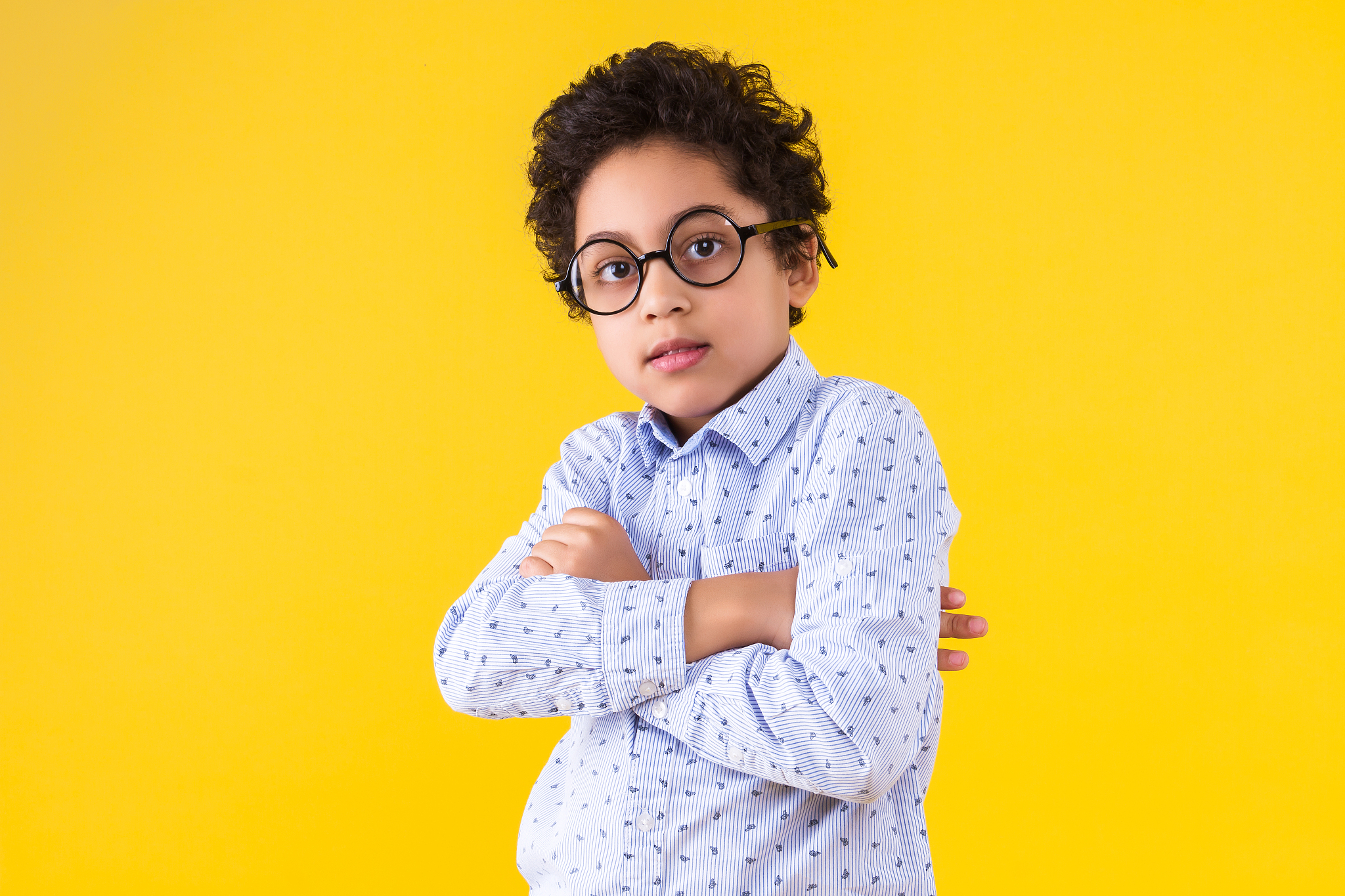 black ethnicity child boy isolated on yellow background