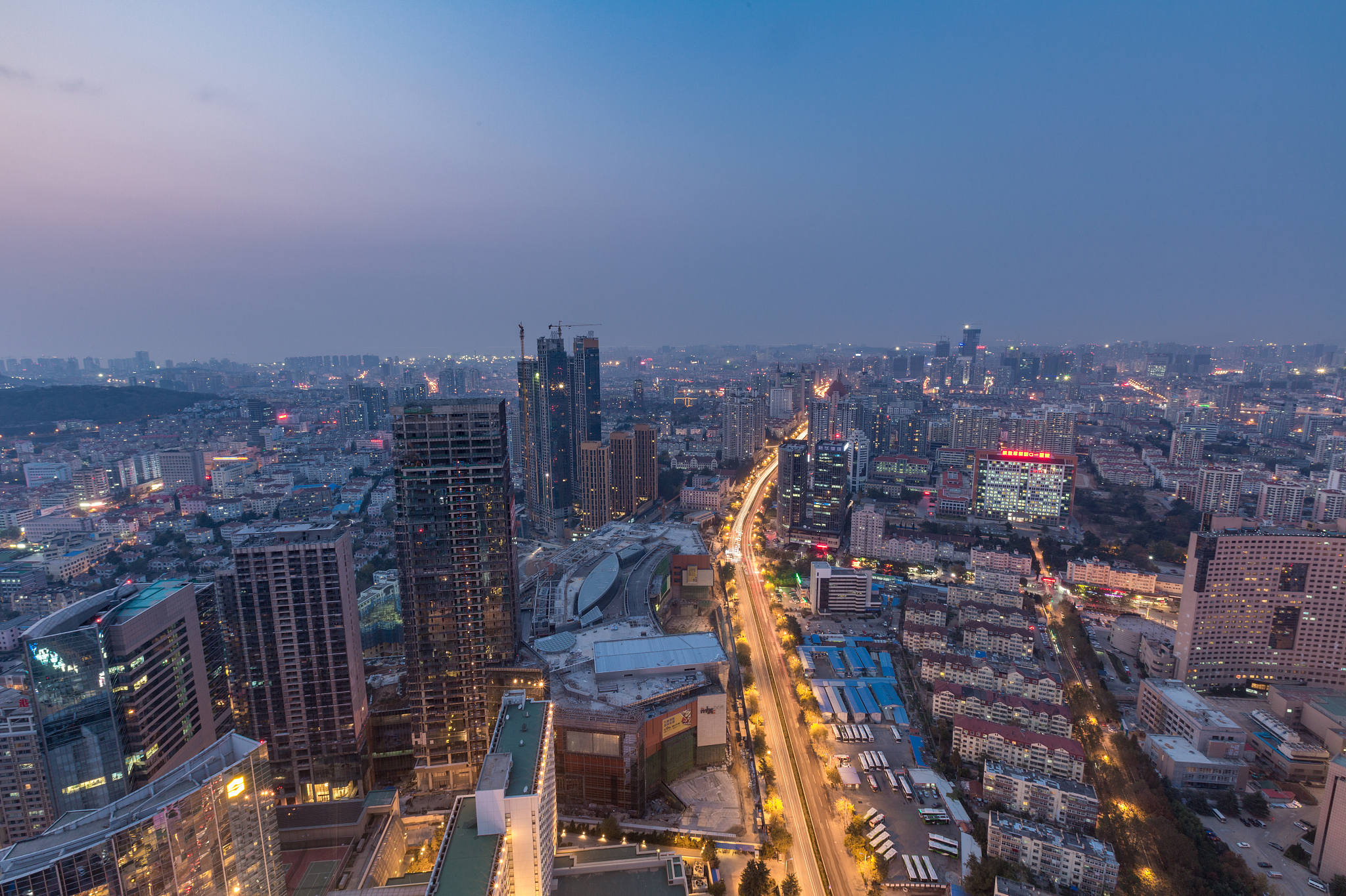high angle view of qingdao skyline at dusk
