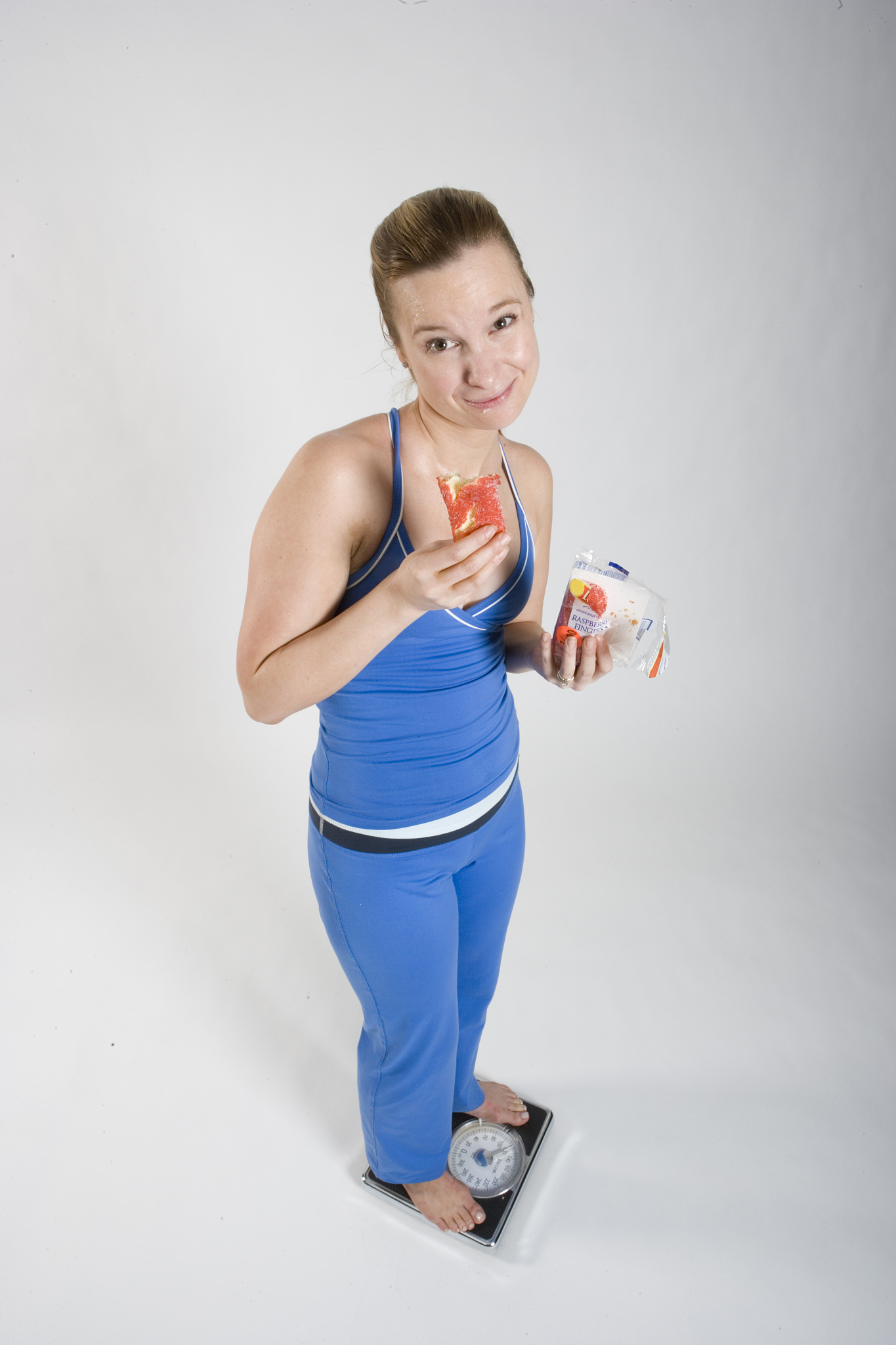 wom on scale eating an unhealthy snack