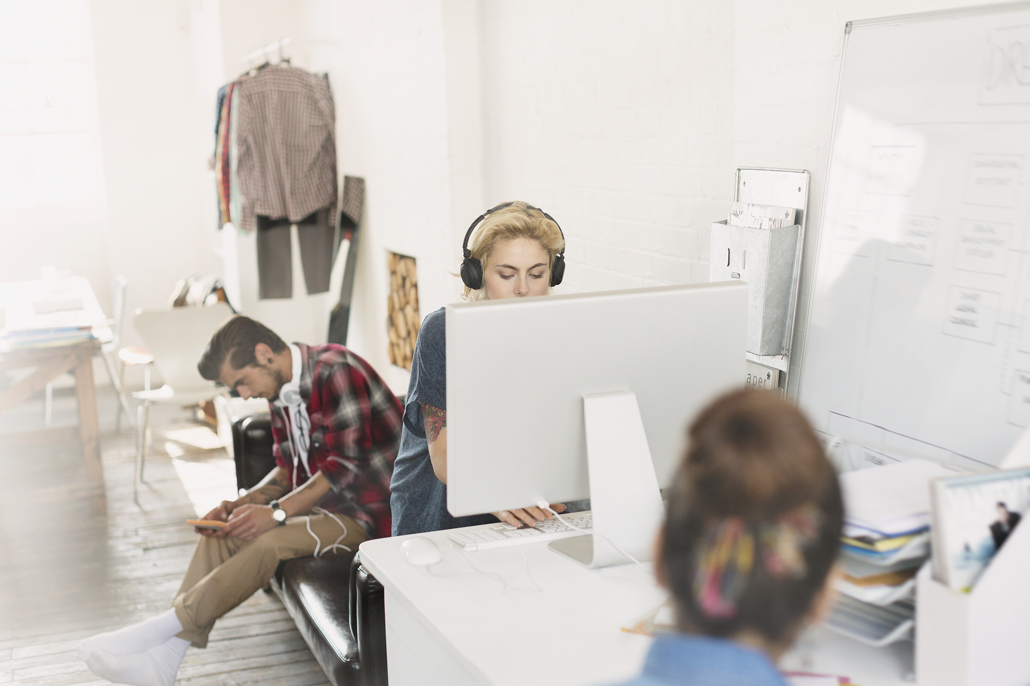 creative young adult designers working in office