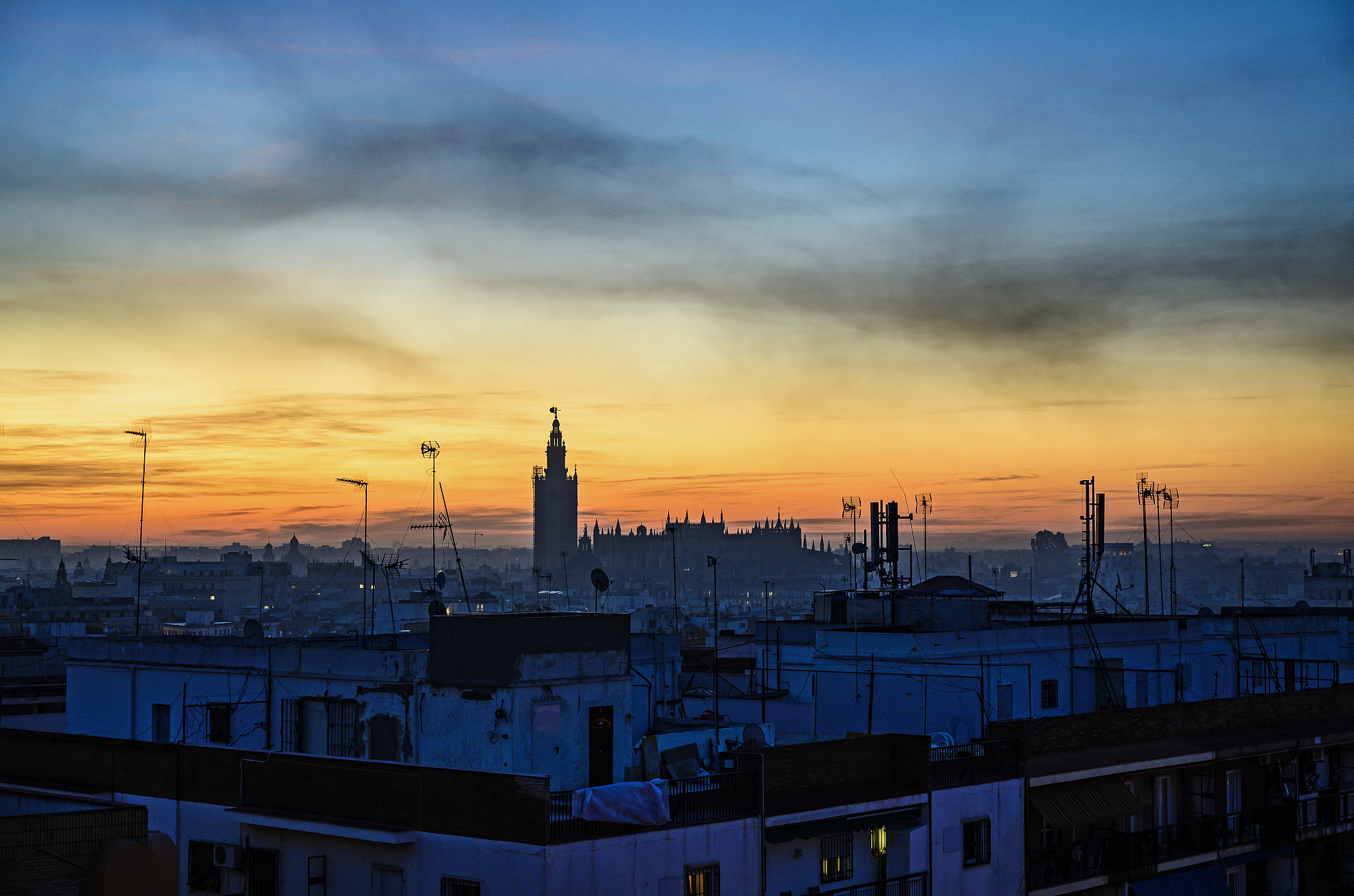 cityscape with seville cathedral at sunrise in seville, andalusi