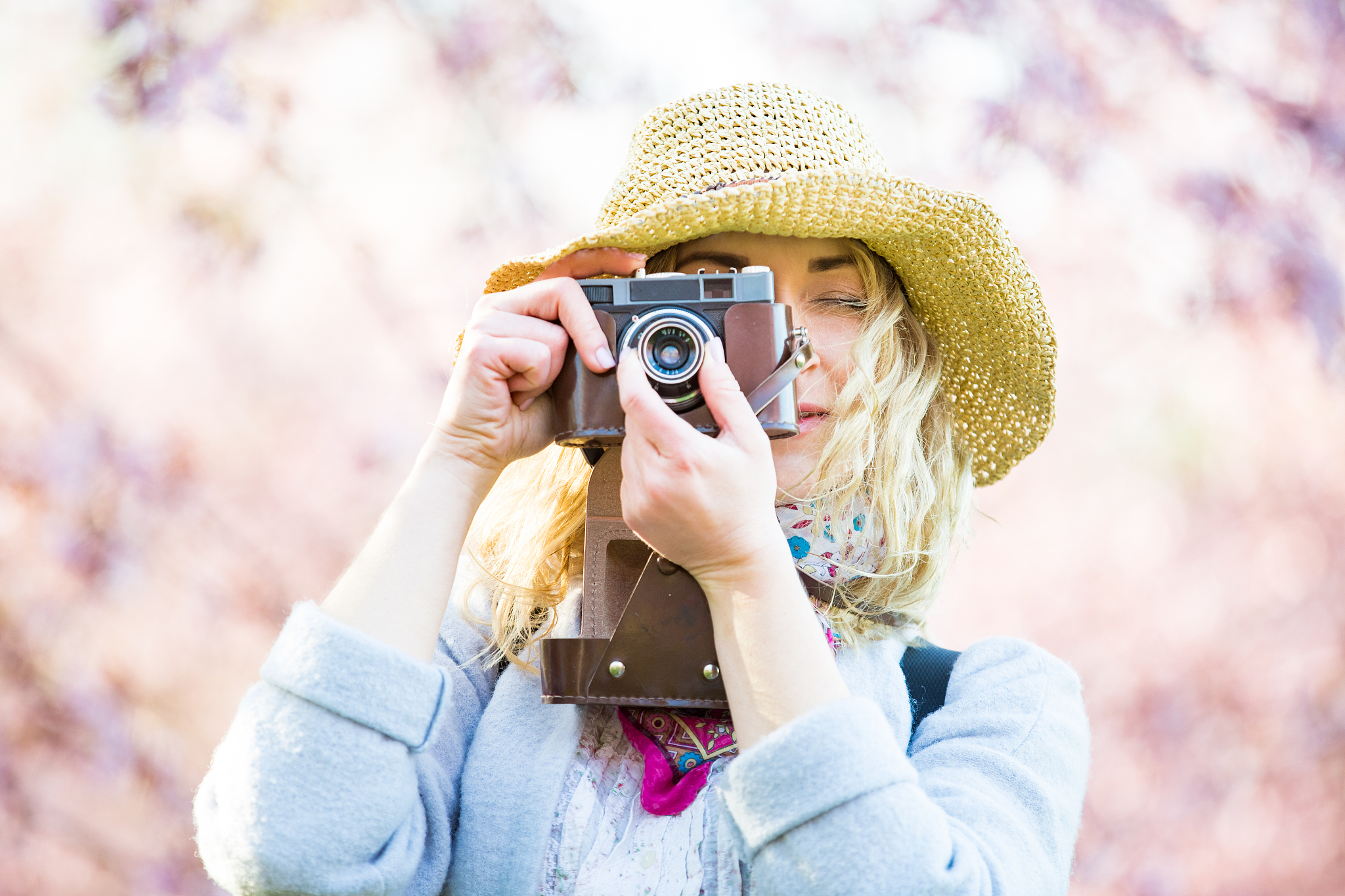 portrait of a beautiful woman in straw hat traveling