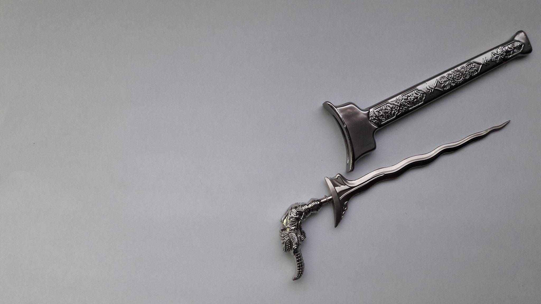 high angle view of sword on table