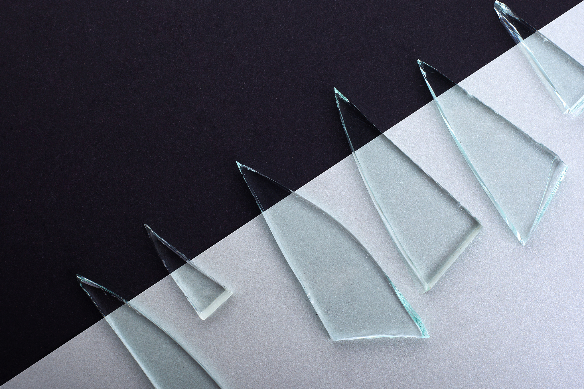 abstract background of broken glass and black and white paper