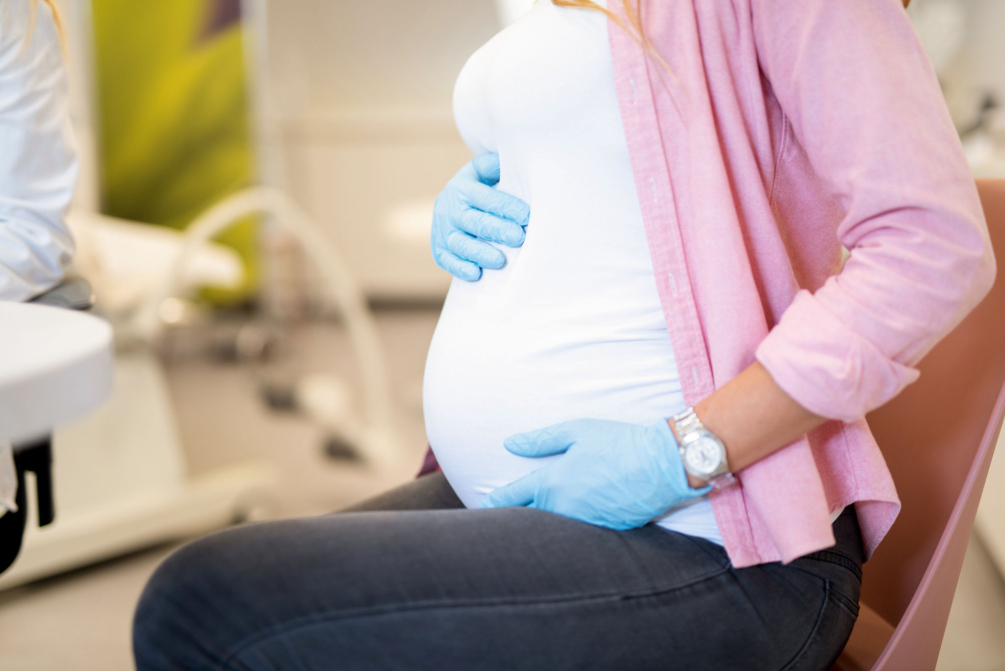 close up of unrecognizable woman on pregnancy exam during covid 