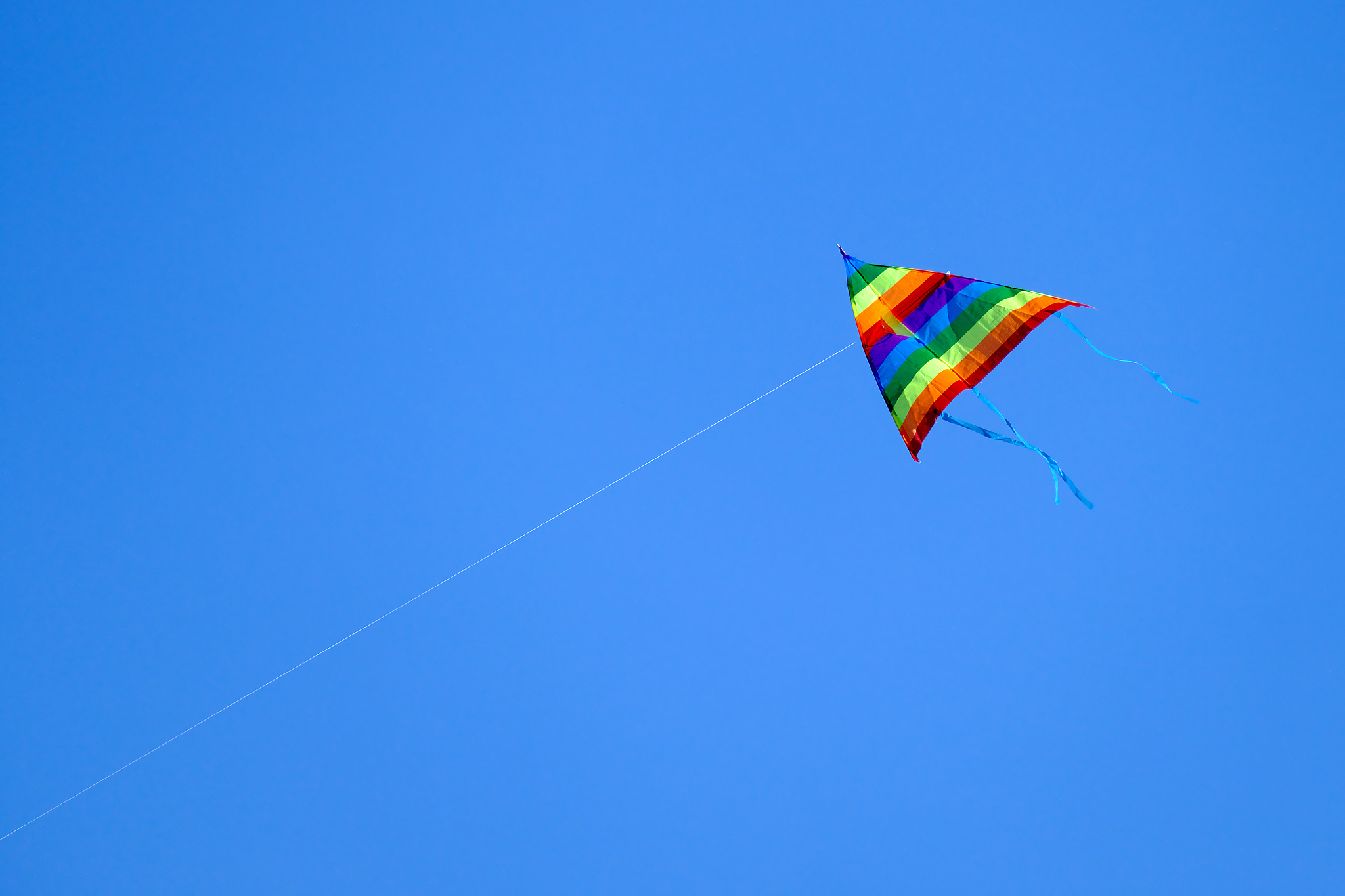 colorful kite flying on background sky.
