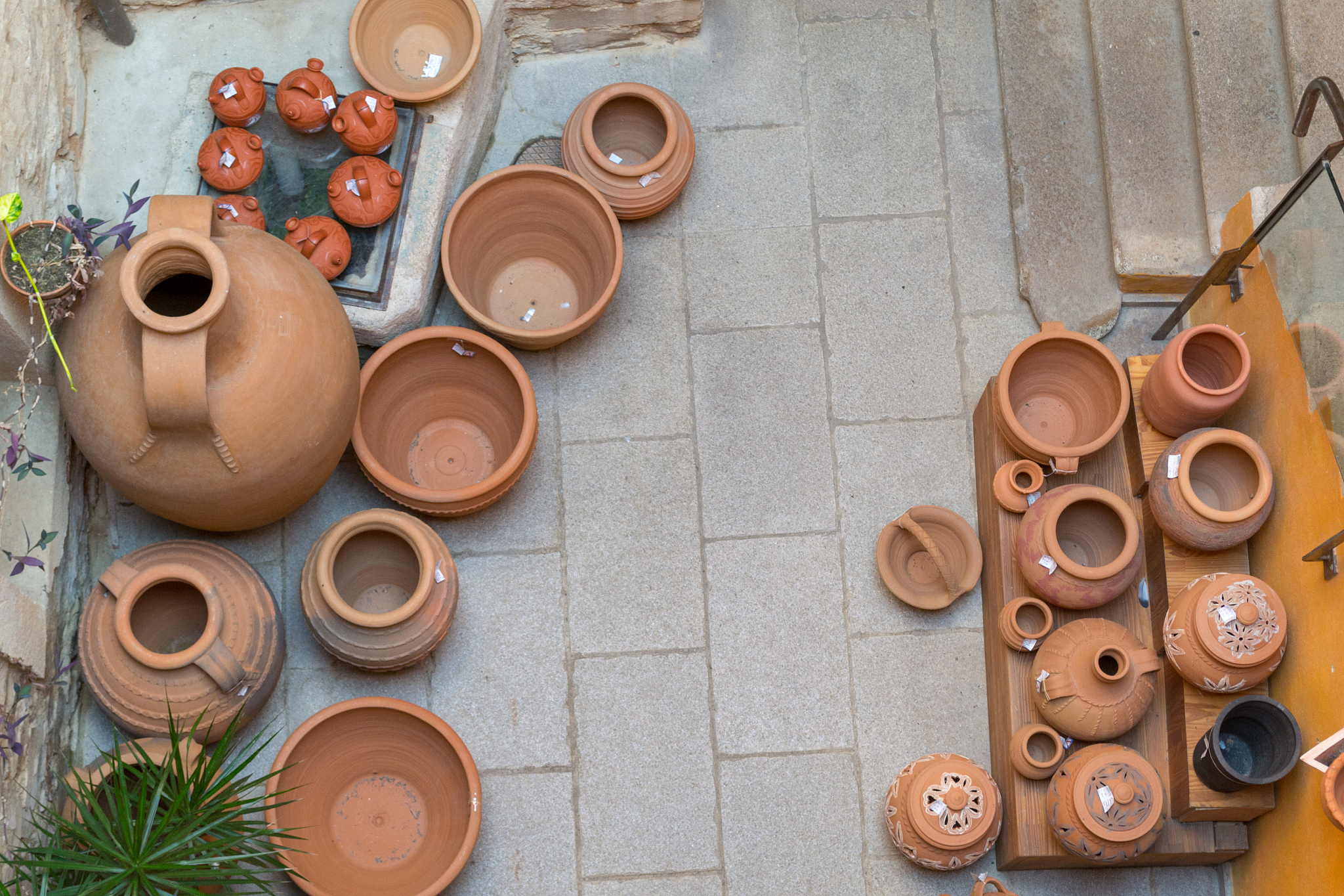 clay vessels on display in a store
