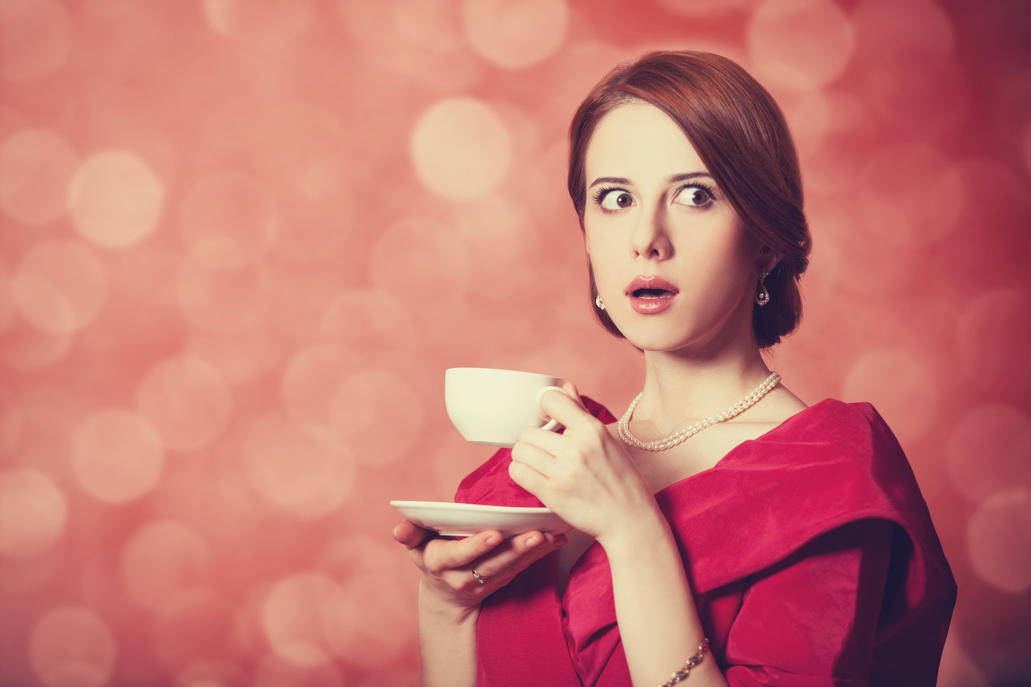 beautyful redhead women with cup of tea.